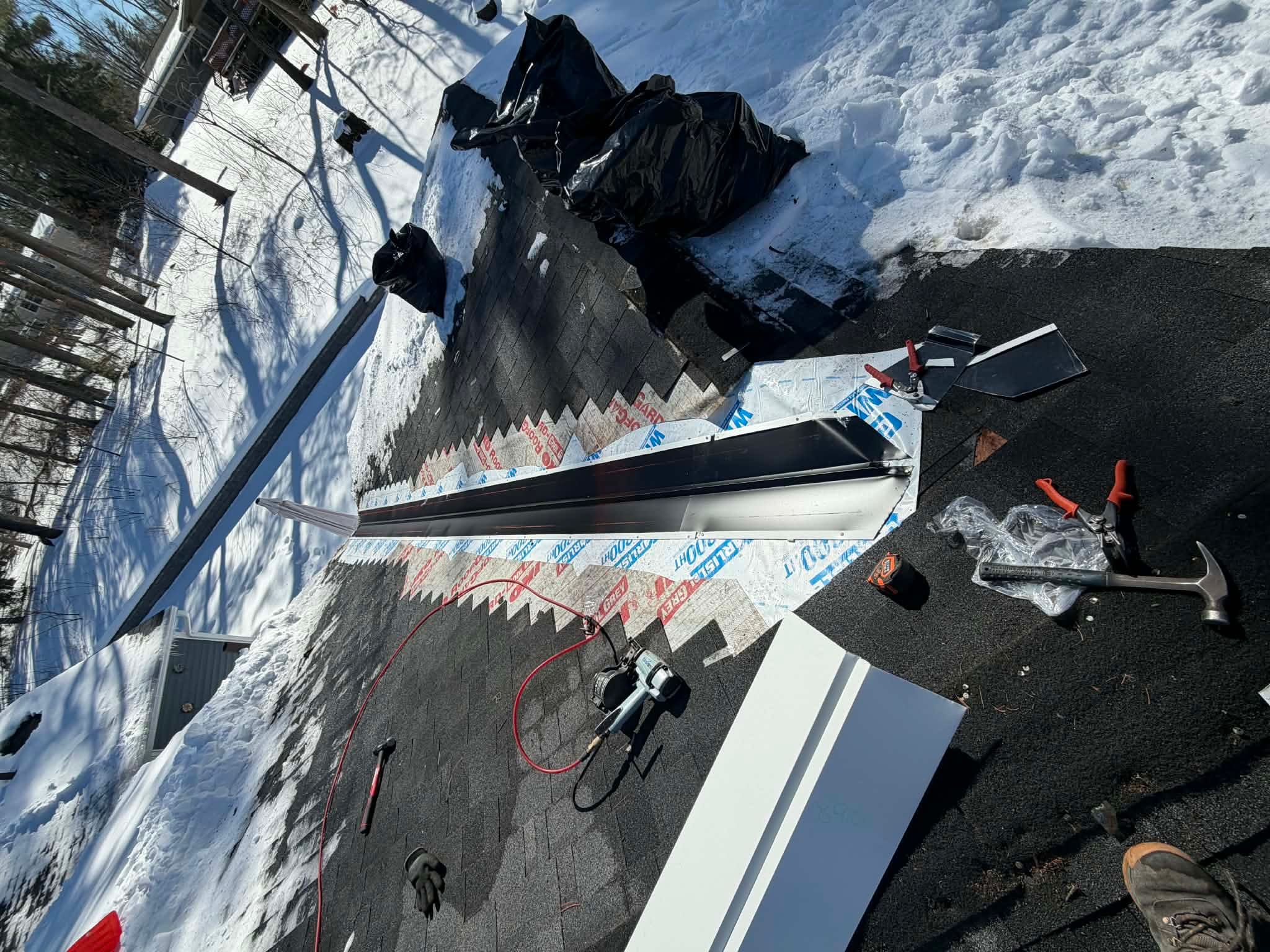 Ridge Cap Replacement & Black Metal Valley Installation in Chelmsford, MA by Mighty Dog Roofing of Greater Middlesex County