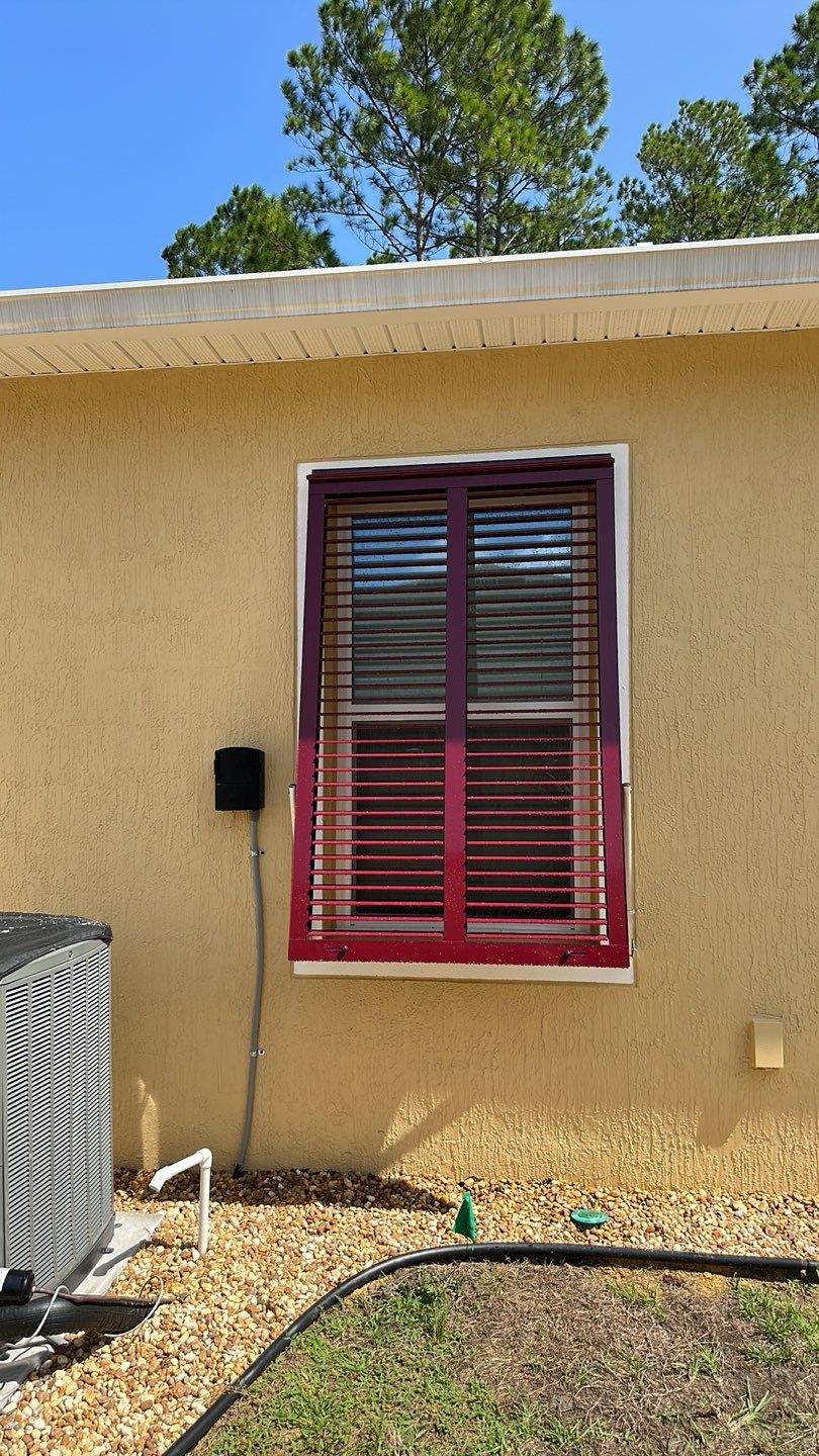 Hurricane Rated Bahama Shutters in Wine Red by Smart Guard Shutters