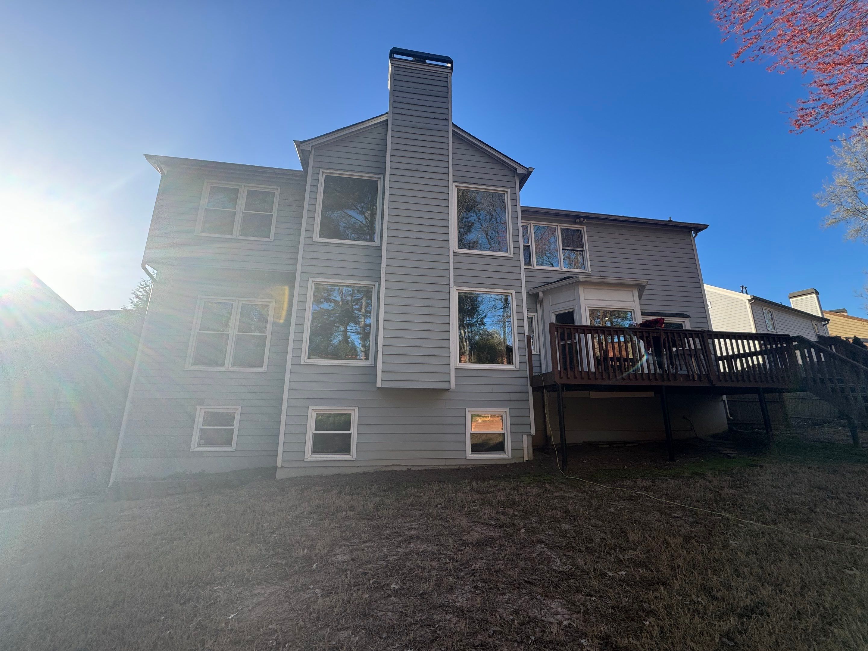 Elevated Deck Replacement with Black Metal Railings in Johns Creek by Swift Home Renovations