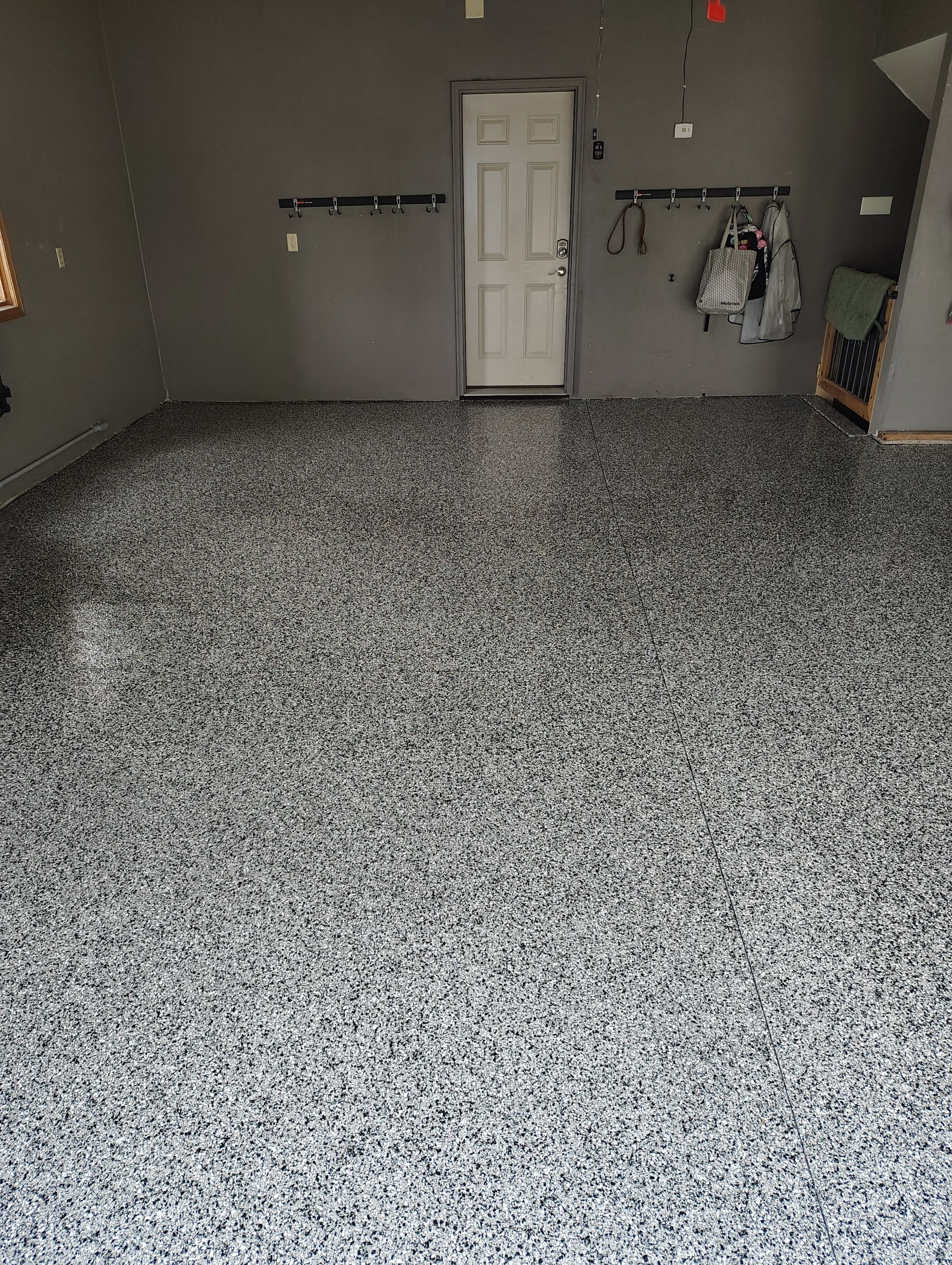 Garage Floor Concrete Coating and Crack Repair in Sioux Falls by Select Painting, Coatings & Garage Cabinets