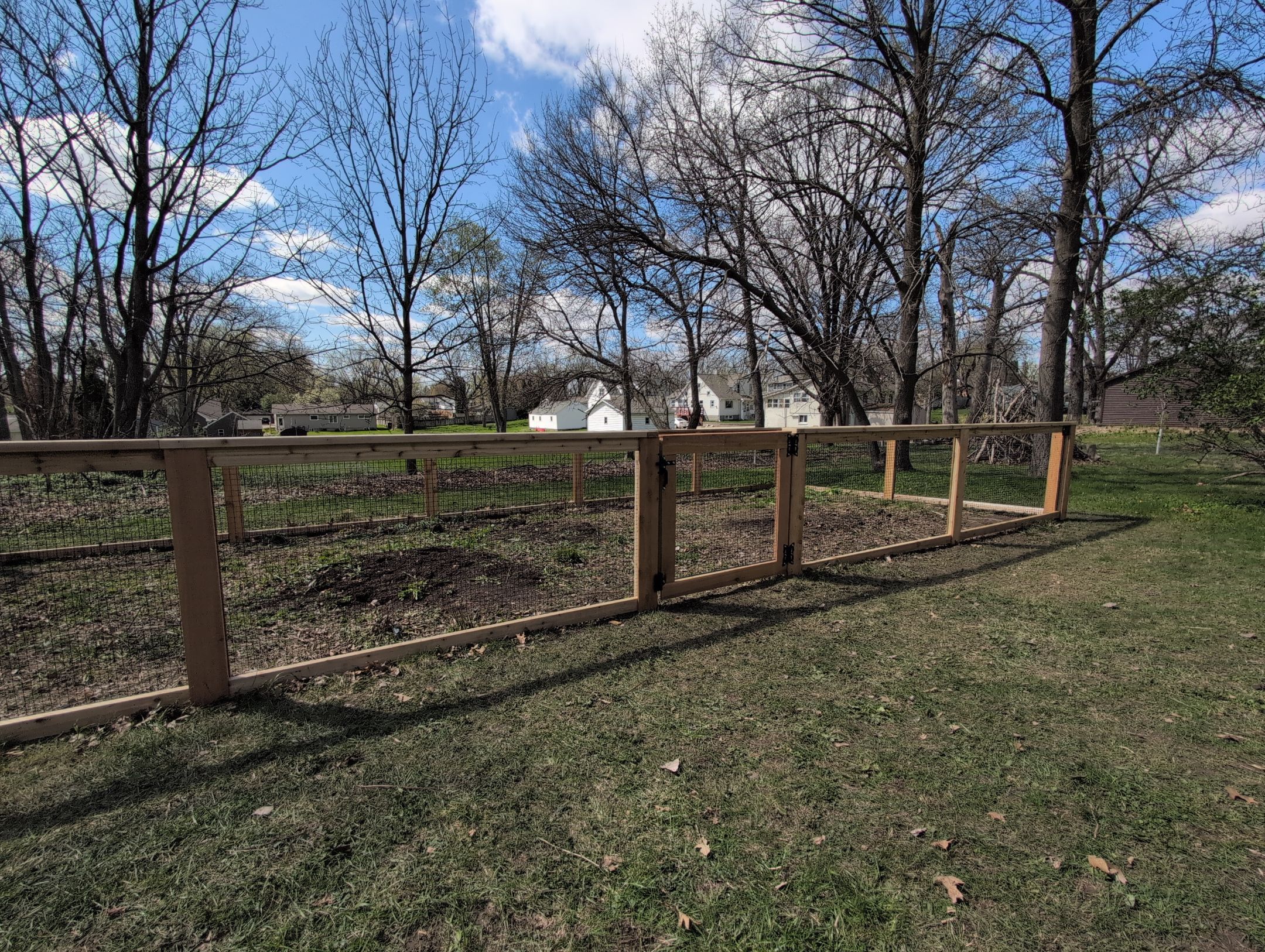 Custom Cedar Wood Garden Fence Installation in Cedar Falls by Perfect Picket Fence and Stain