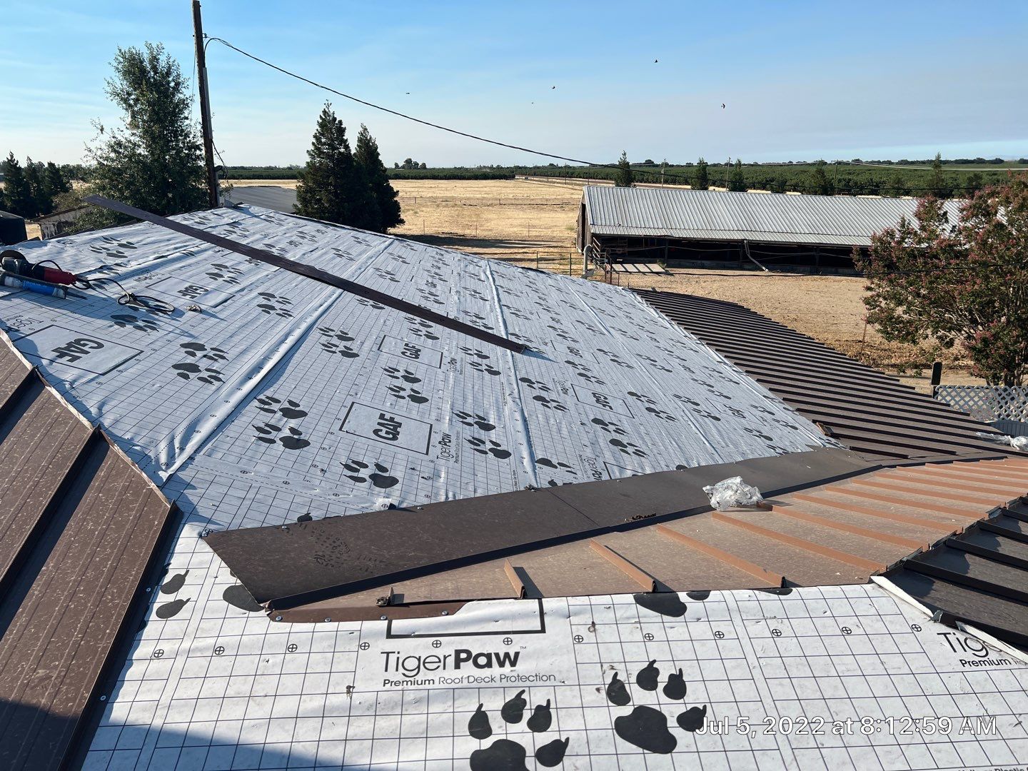 Metal roofing installation using Standing seam metal roofing system by Straight Edge Roofing Inc