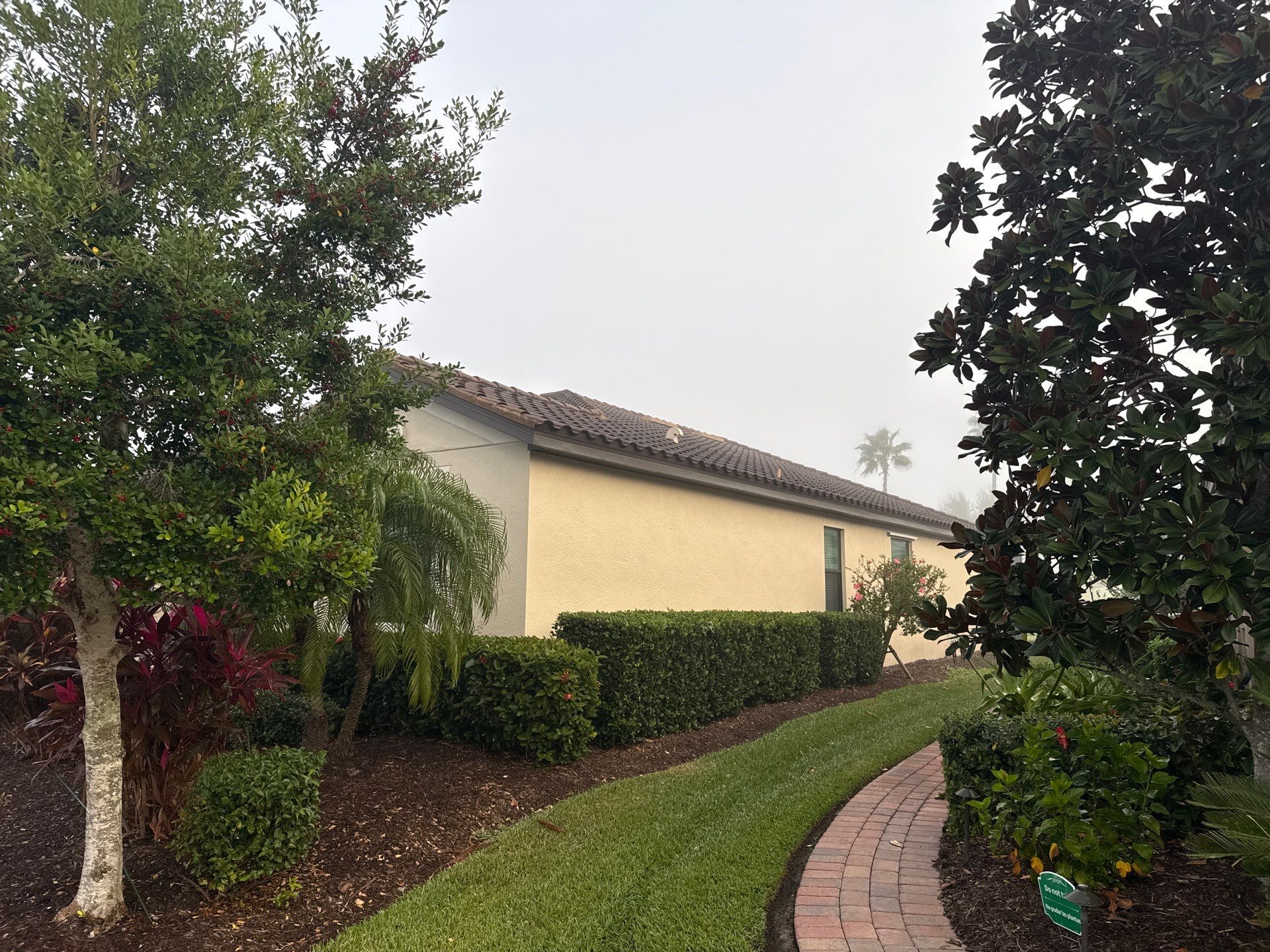 Barrel Tile Roof Cleaning & Paver Driveway Cleaning in River Strand at Heritage Harbour | Bradenton, FL by Sunshine AquaWash
