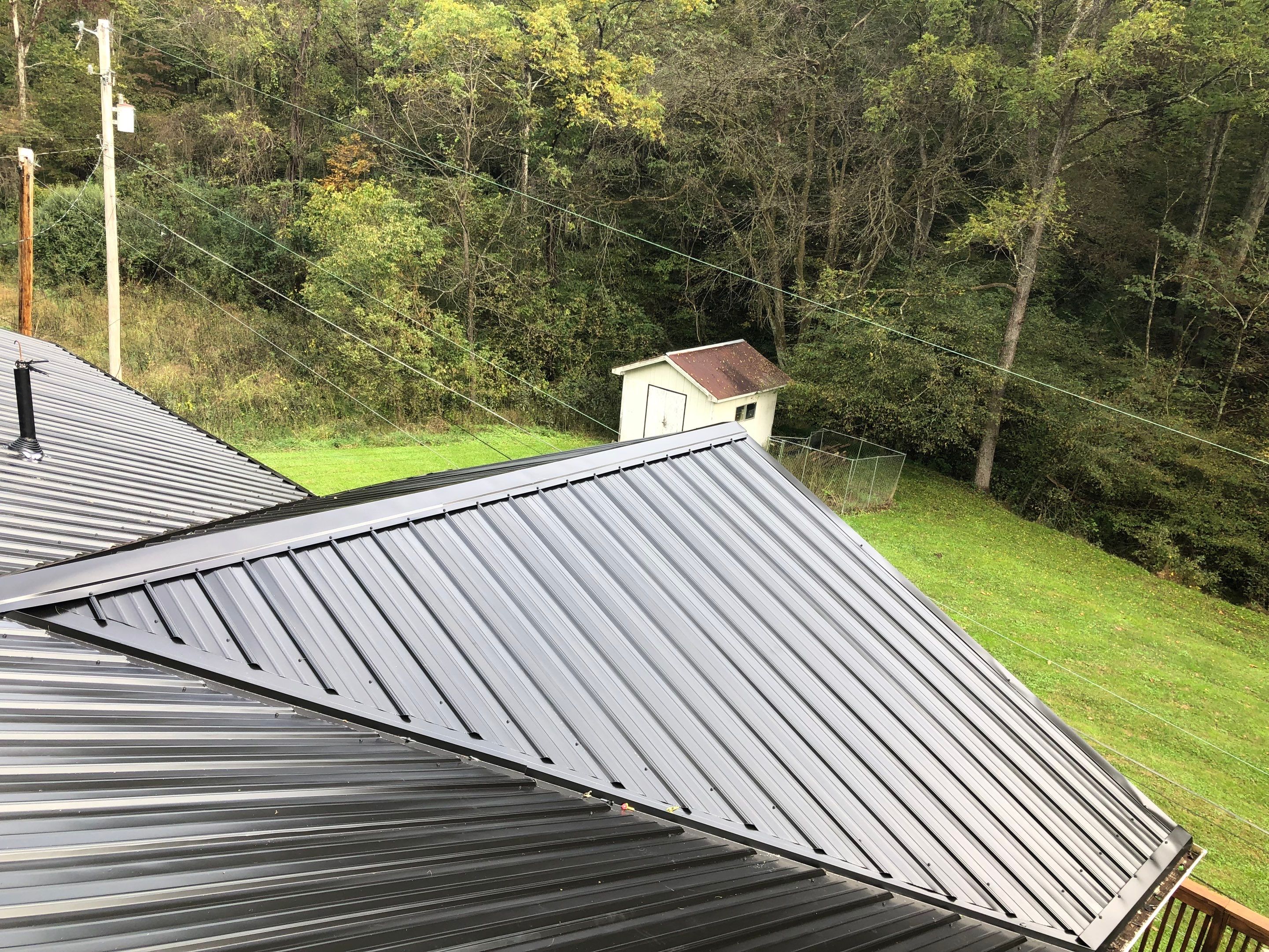 Metal Roof and Vinyl Siding, Soffit, Gutters using LifeTite Premium metal roofing  by Secure Construction Company Inc