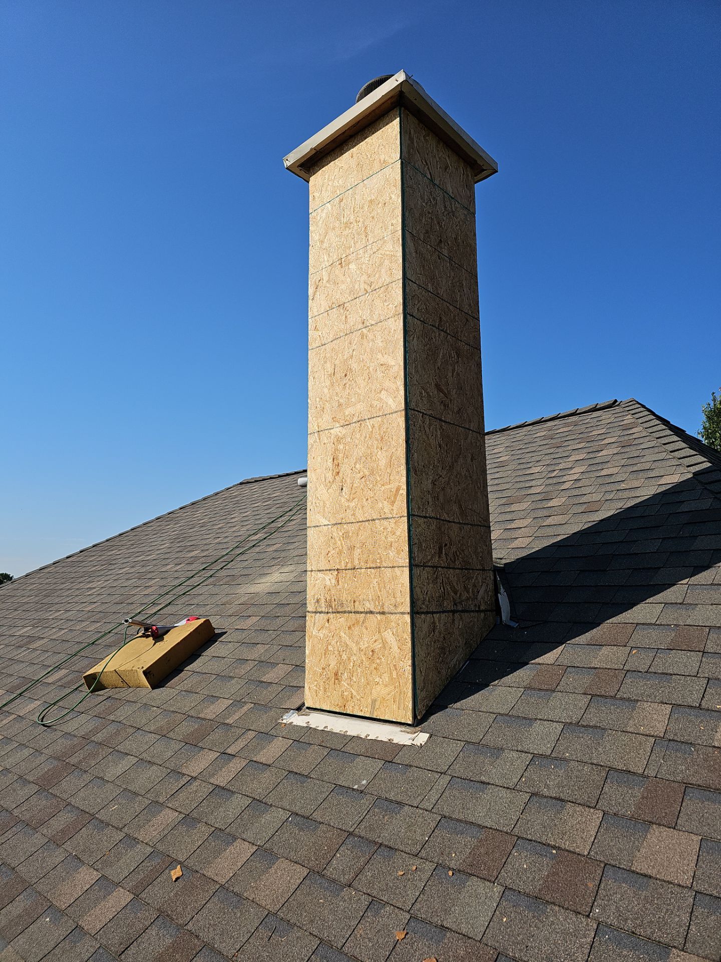 chimney repair using lap engineered treated composite siding. by road roofing llc