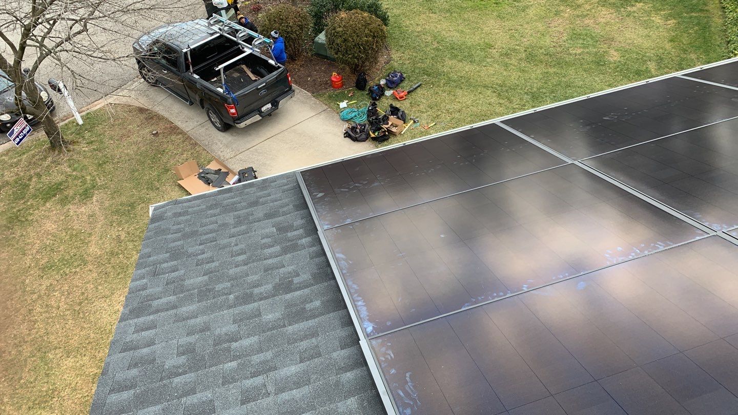 Roof Replacement with GAF Decotech integrated solar panels by American Home Contractors