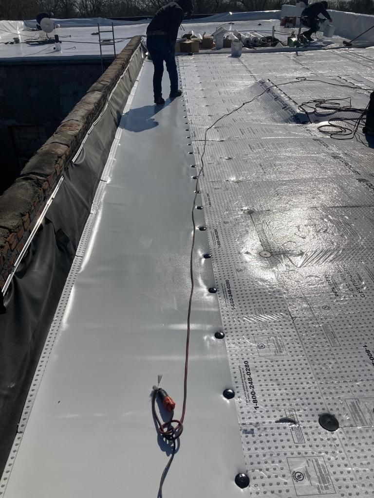Roof Recover on a downtown building in Lake City  by Grell Roofing