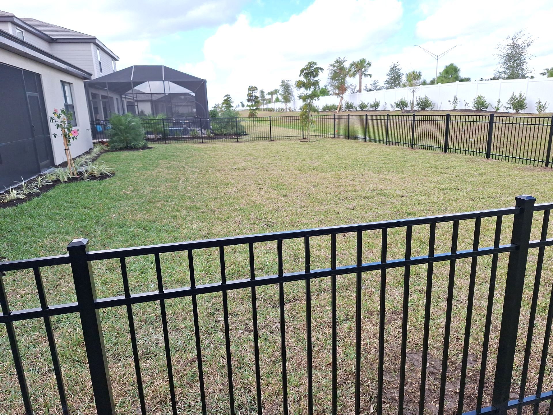 Aluminum Fence Installation using 4ft 3 Rail Black Aluminum Fence by Asap fence and gates, LLC