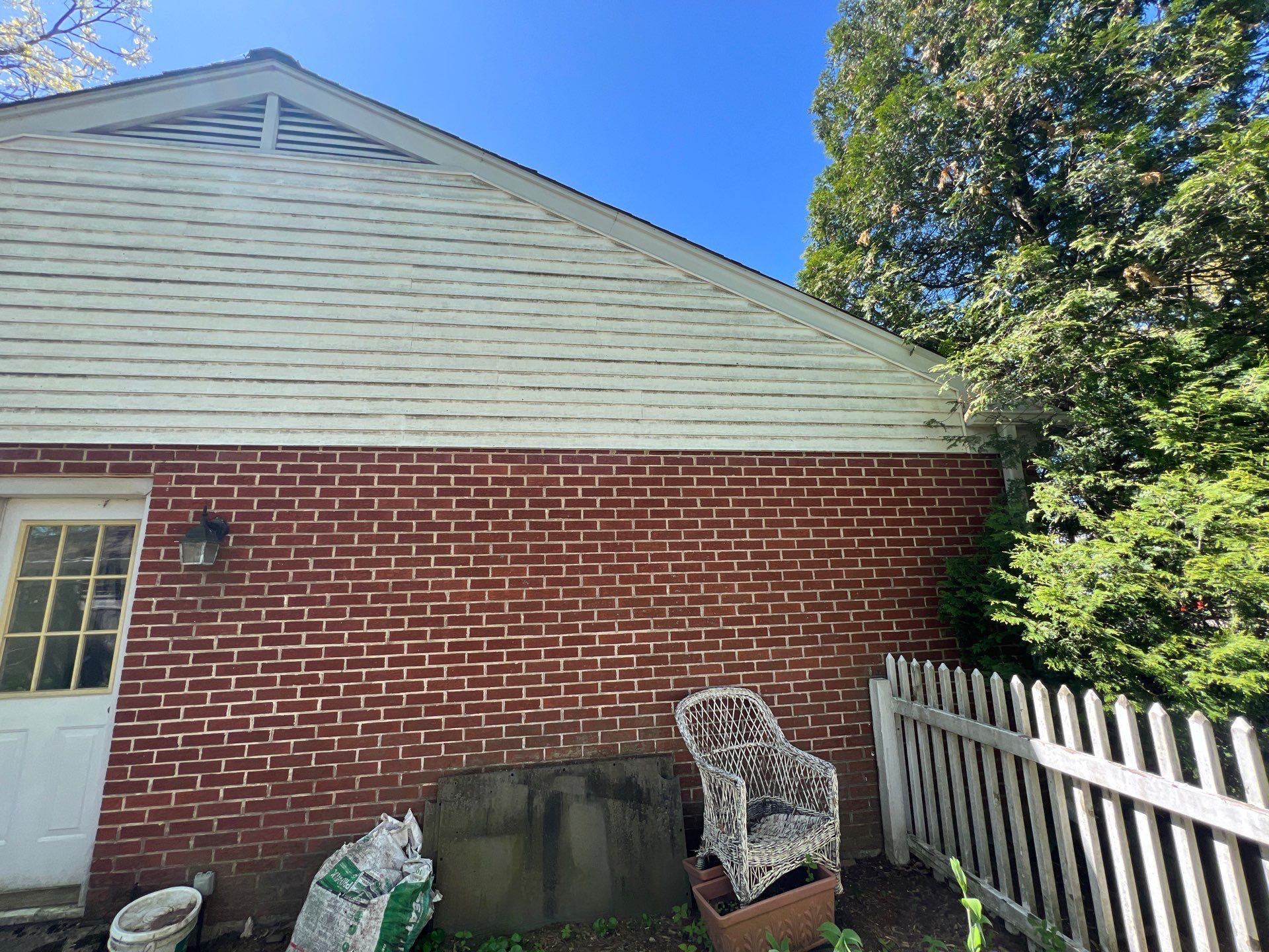Housewashing  using Algaecide, soft wash soap by Northern Power Washing LLC.