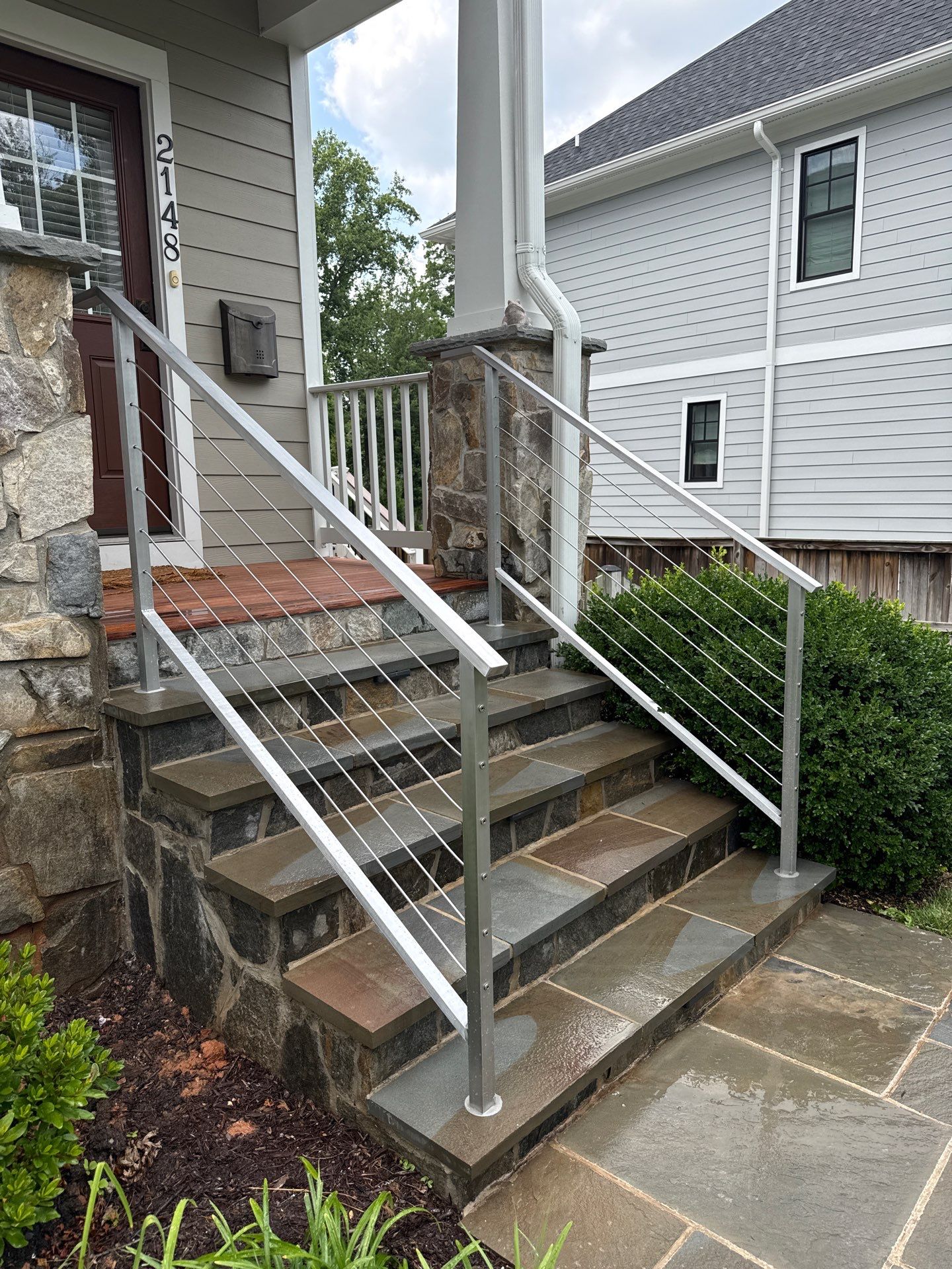 Custom Stone Porch Steps with Modern Cable Railing in Falls Church by Capitol Iron Works