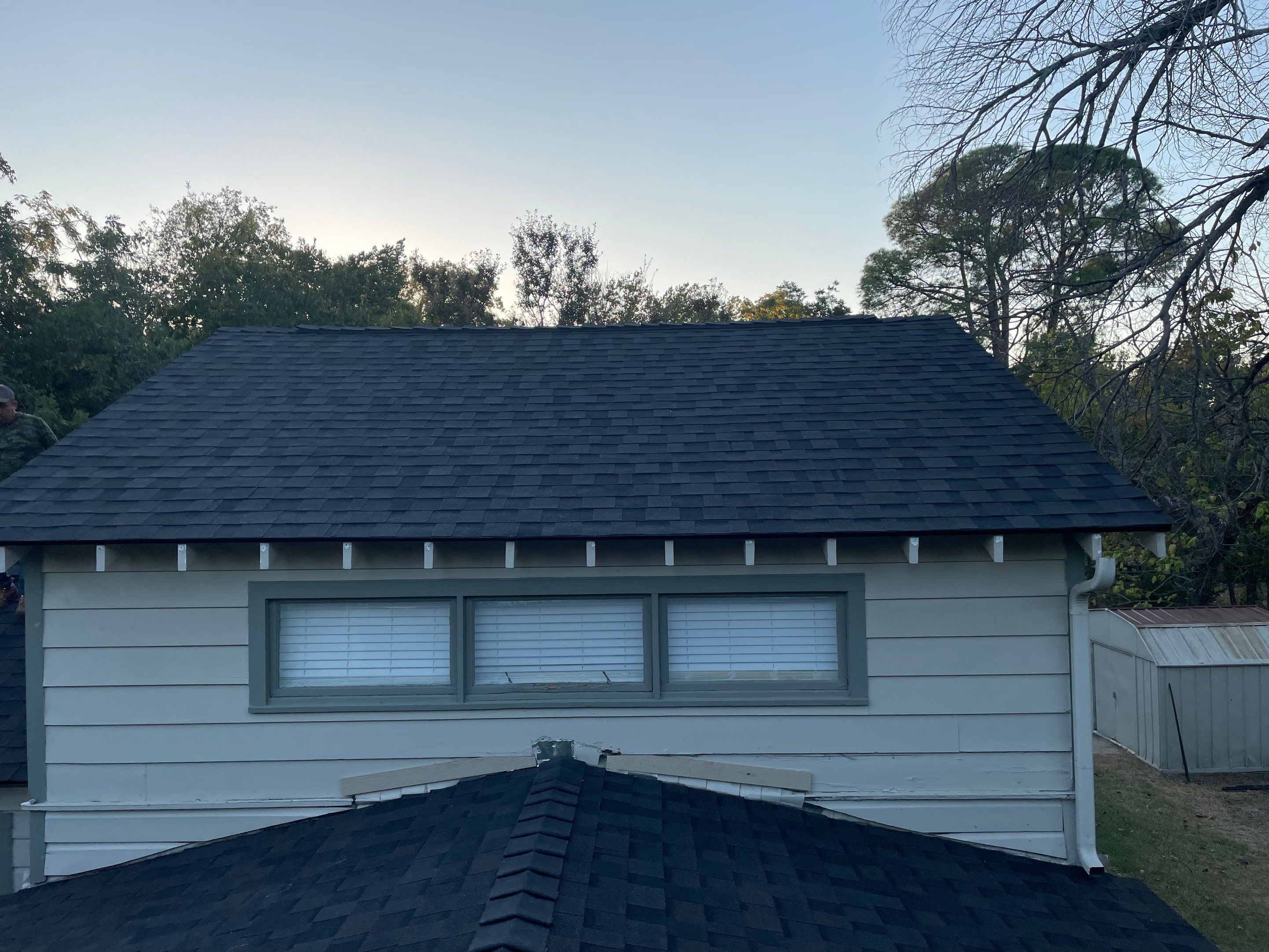 White exterior with IKO Glacier by Tejas Roofworks + Restoration