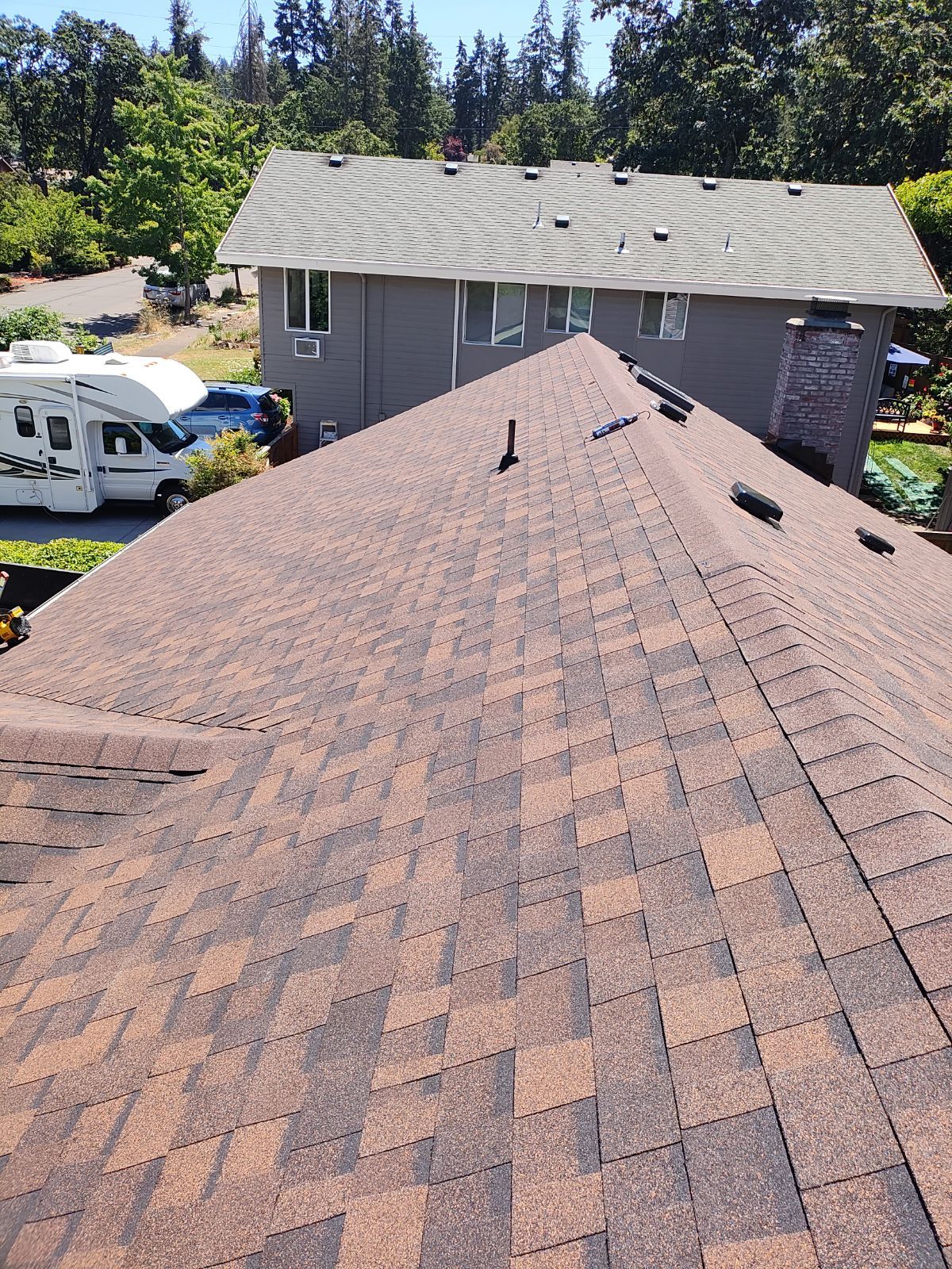 Residential Reroof using Owens Corning Duration Shingles in the color Brownwood. by BEST Roofing & Waterproofing