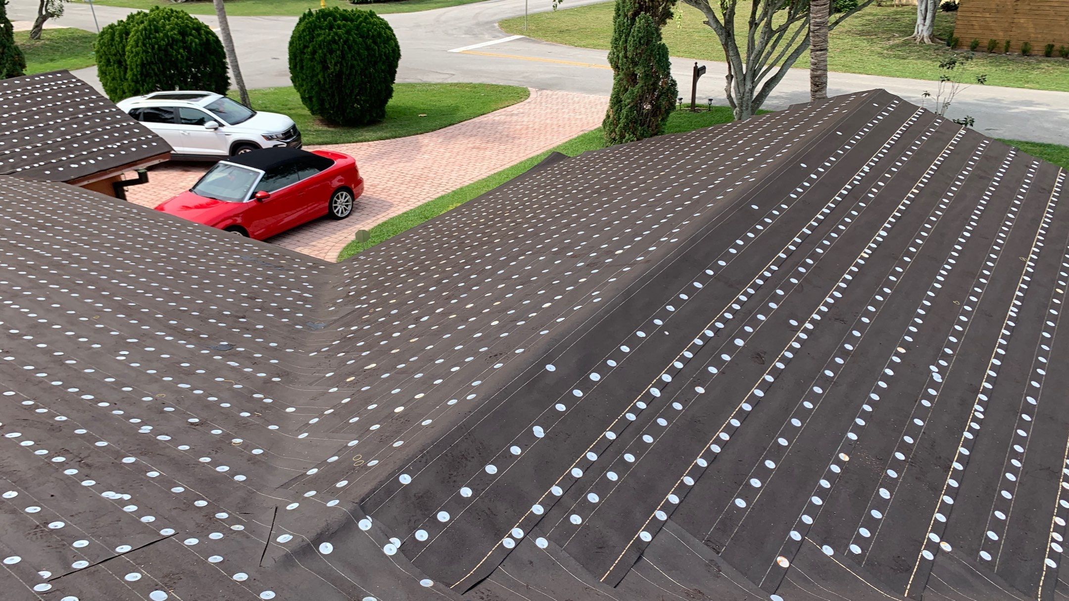Residential Roofing Installation using 1" Nail strip metal roof by BLUES BROTHERS ROOFING