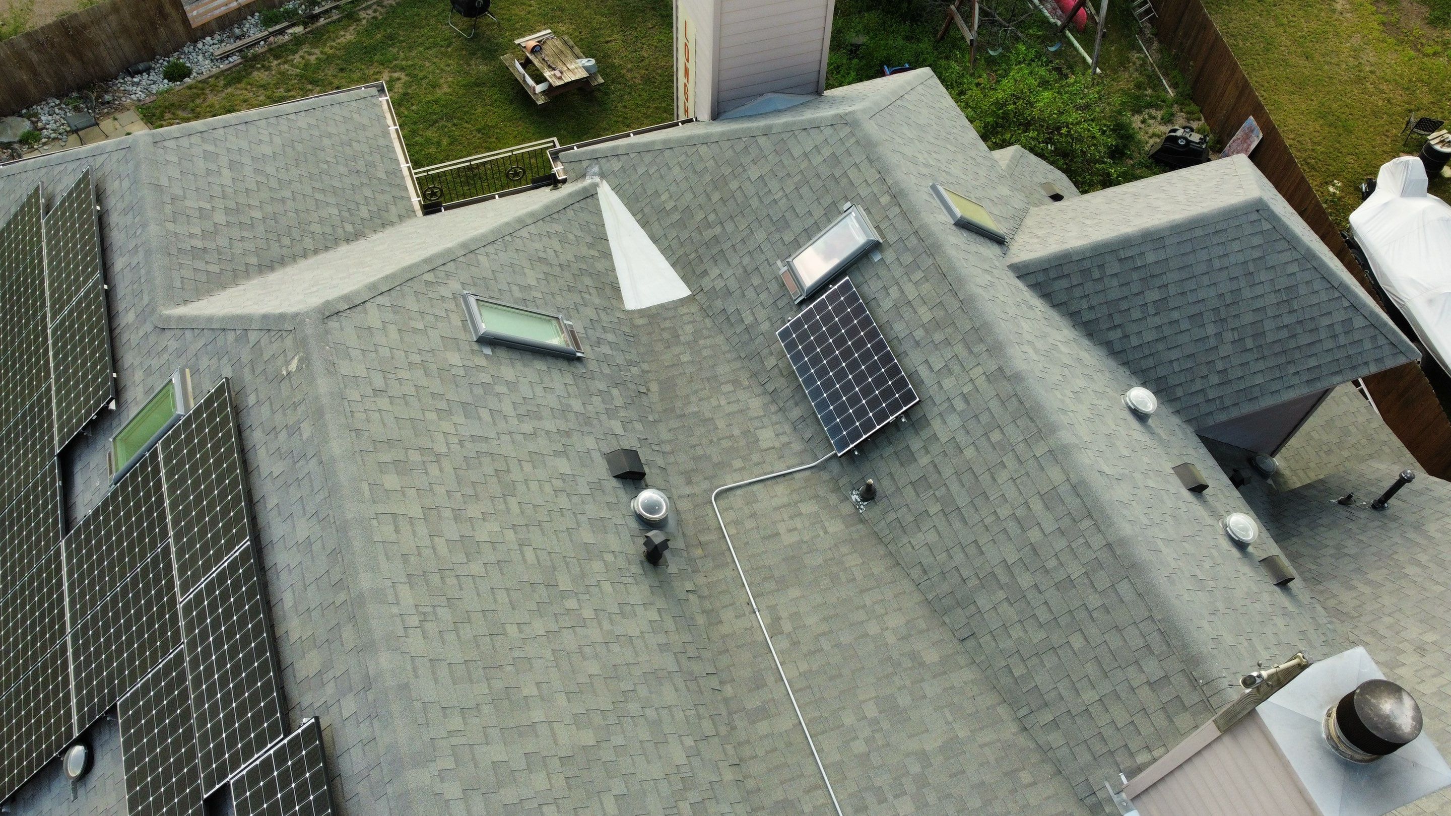 Residential Roof Replacement and Solar Panel Integration in Austin by Caliber Restoration LLC