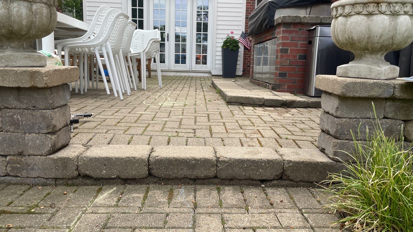 Brick patio repair, clean sand and seal by Northern Power Washing LLC.