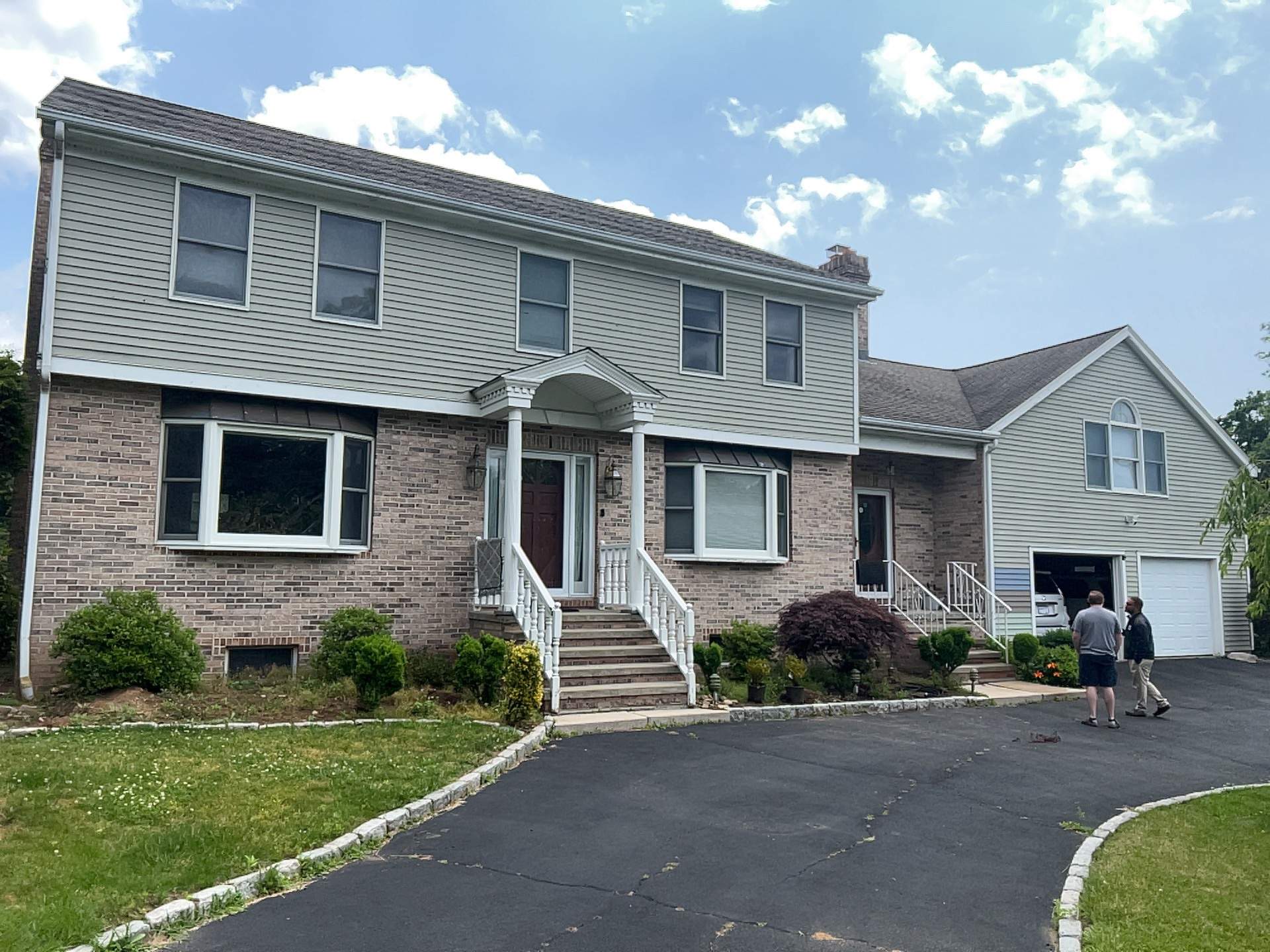 Siding Installation using Mainstreet Colonial & White gutters by A Plus Exterior