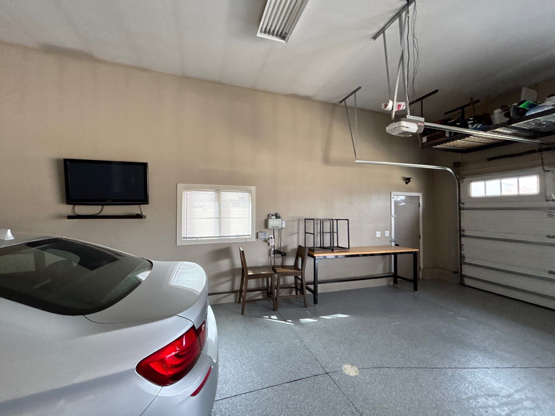 Speckled Grey Epoxy Garage Floor Coating Installation in Tea by Select Painting, Coatings & Garage Cabinets