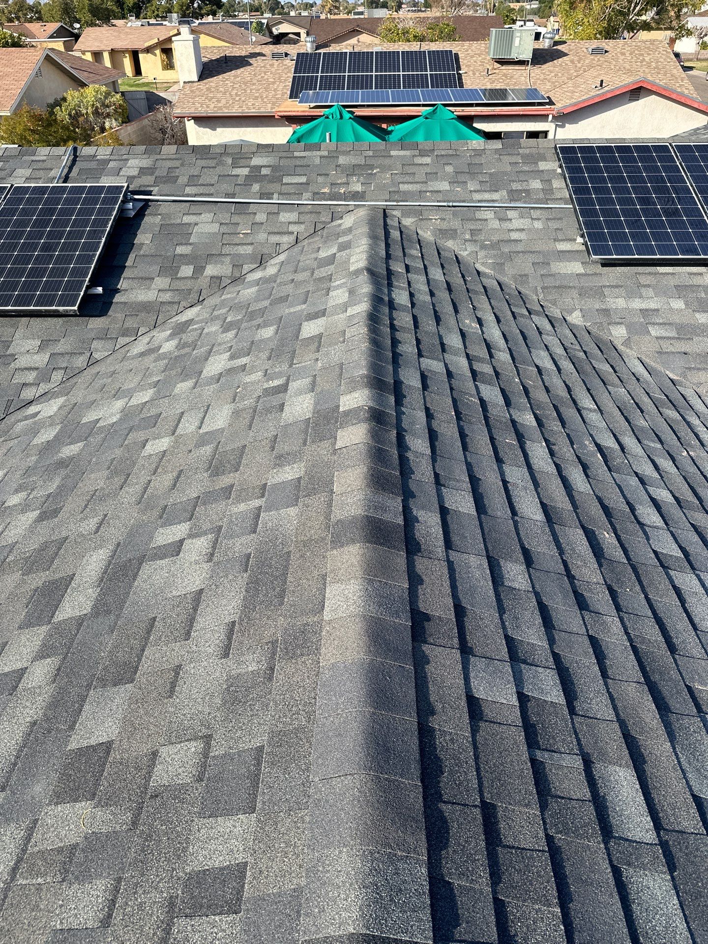 Charcoal Shingles by Reimagine Roofing