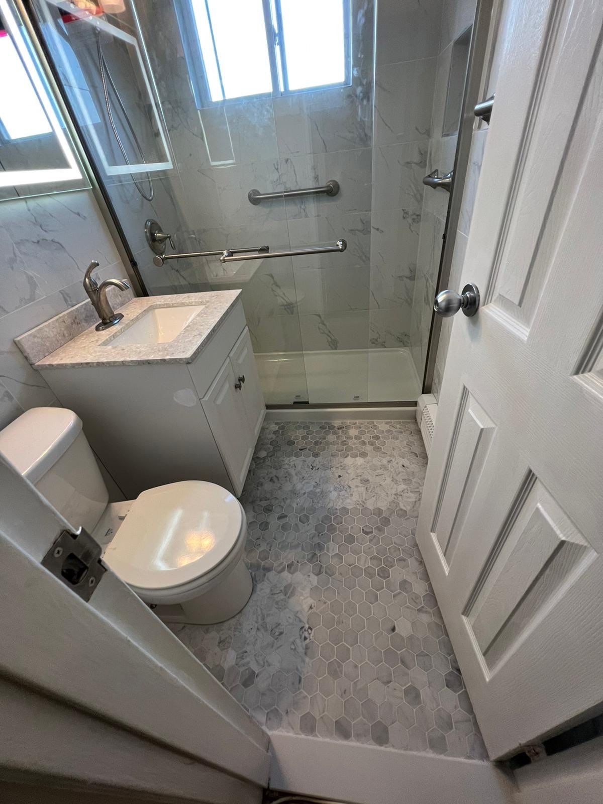 Bathroom Remodel using Tile by Home Concepts Construction