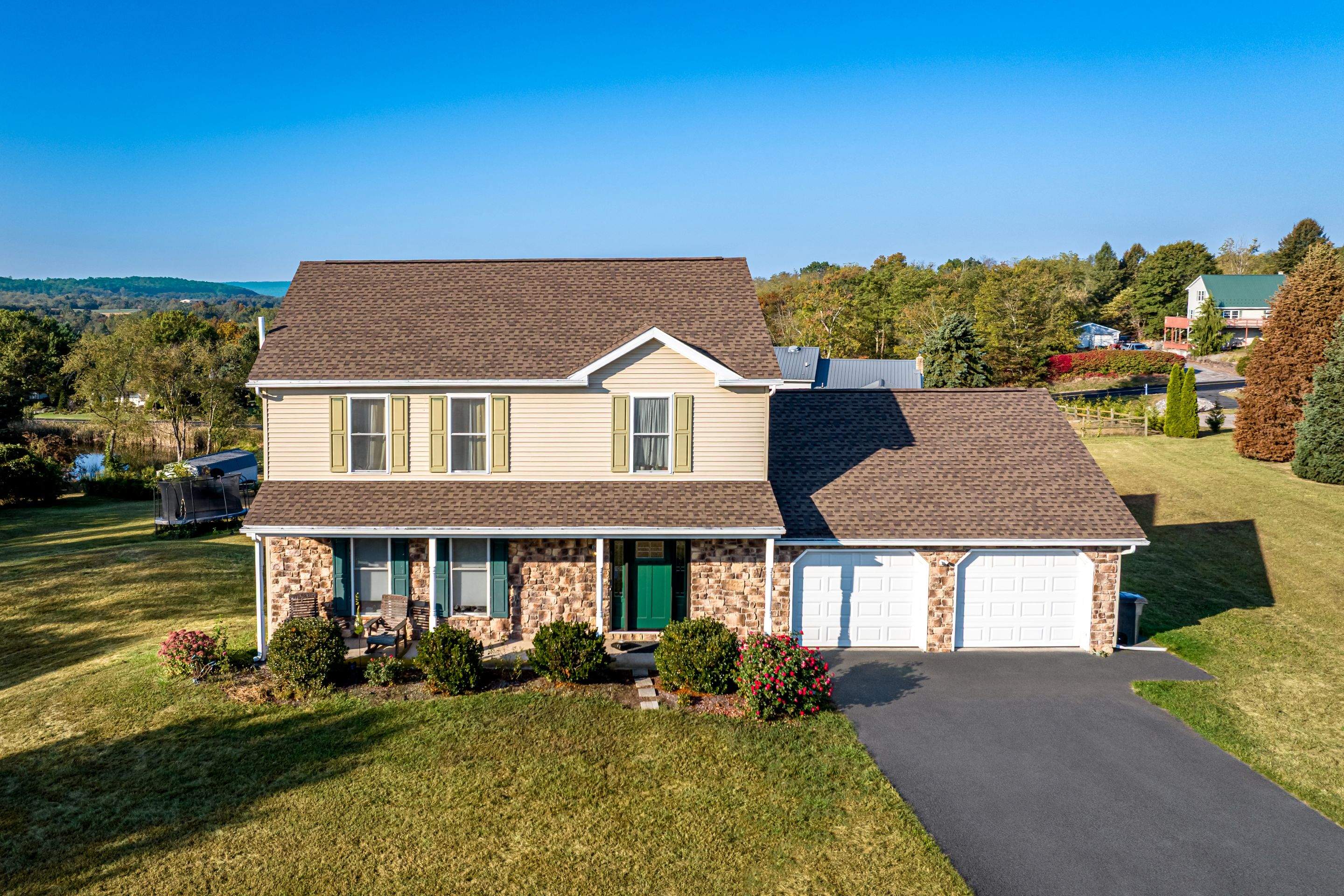 Reshingle and Entry Door by Esh Builders