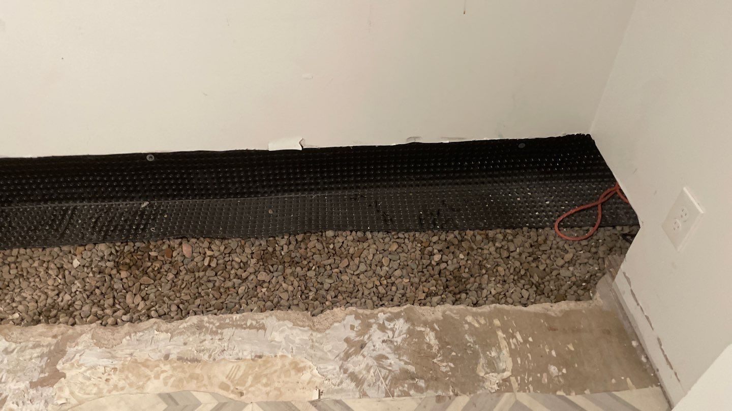 Interior Drain Tile & Buried Discharge in St. Anthony, MN by Waterproofing Northeast