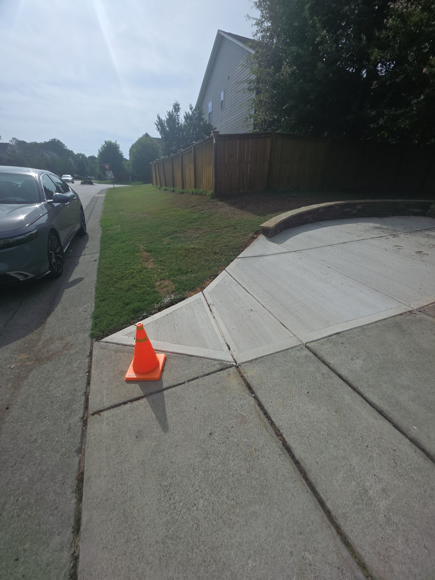 Concrete Driveway Expansion & Retaining Wall | Apex, NC by Elite Remodeling and Design LLC