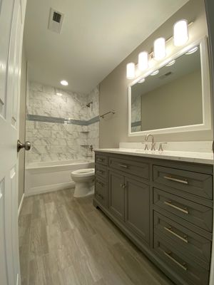 Acworth Basement Transformation With Wet Bar and Stone Fireplace