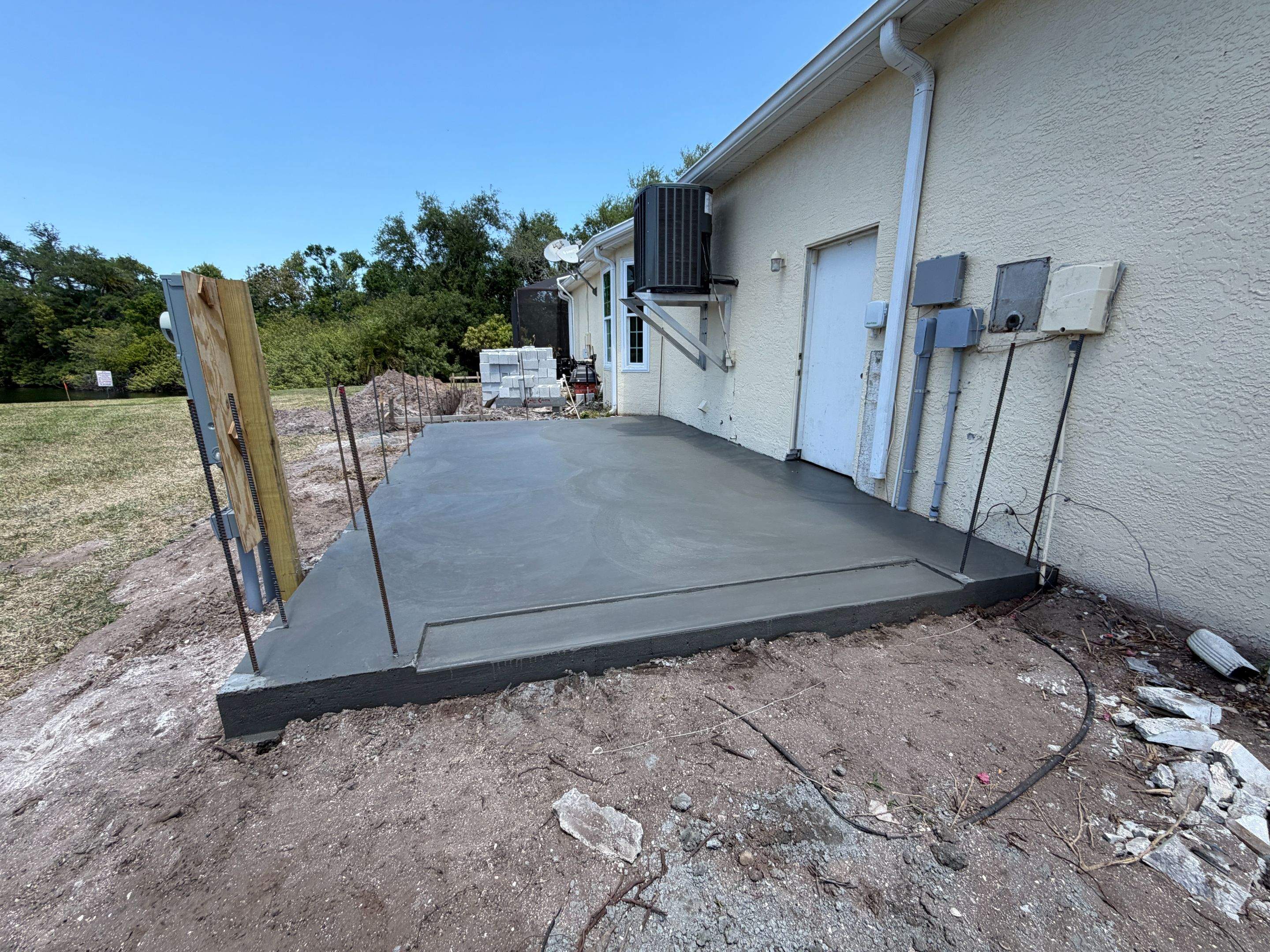Custom Single-Car Garage Addition and Lanai Cage in Bradenton by Vertical General Contracting 