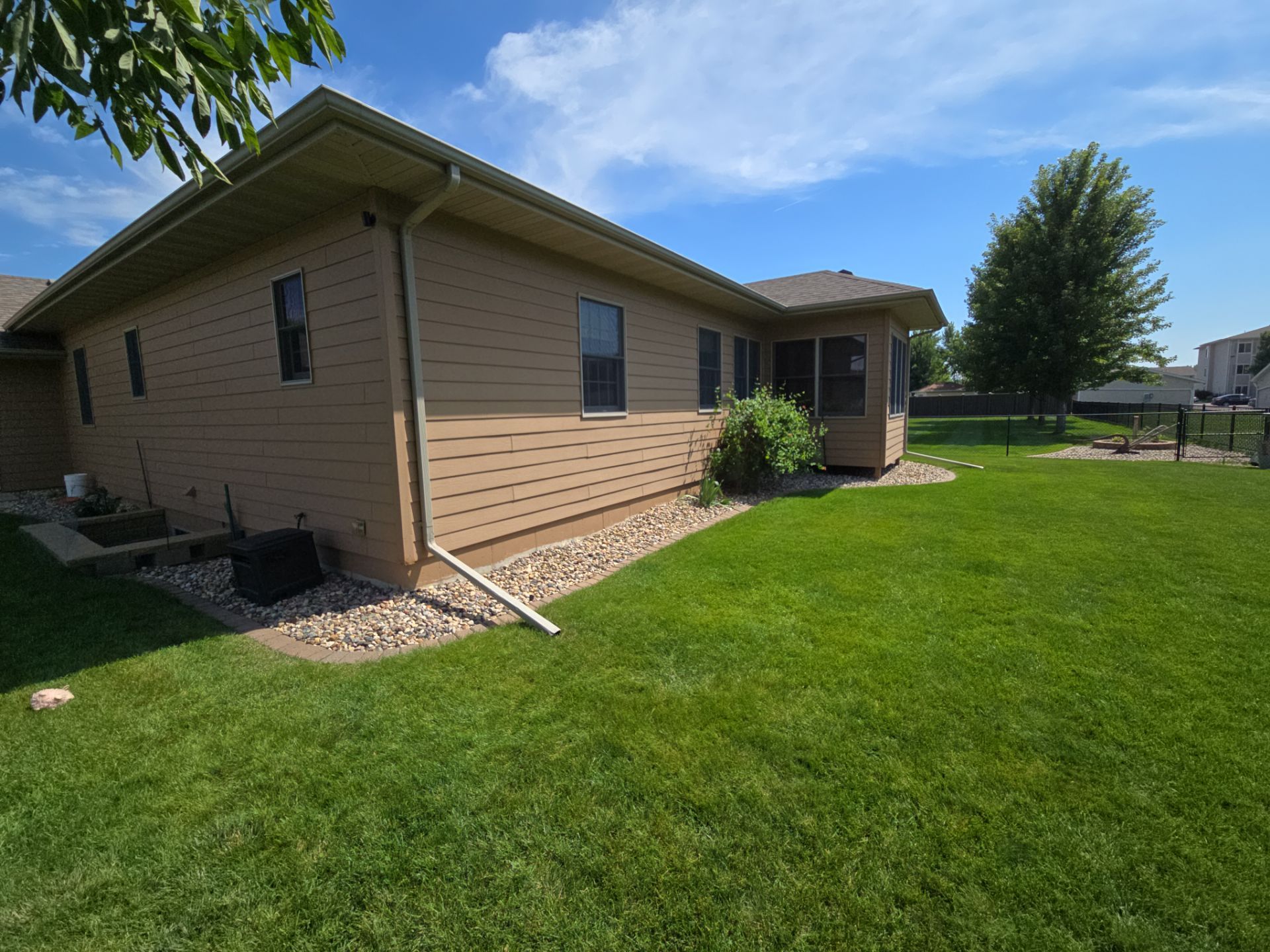 Sioux Falls Residential Exterior Door and Siding Refresh by Select Painting, Coatings & Garage Cabinets