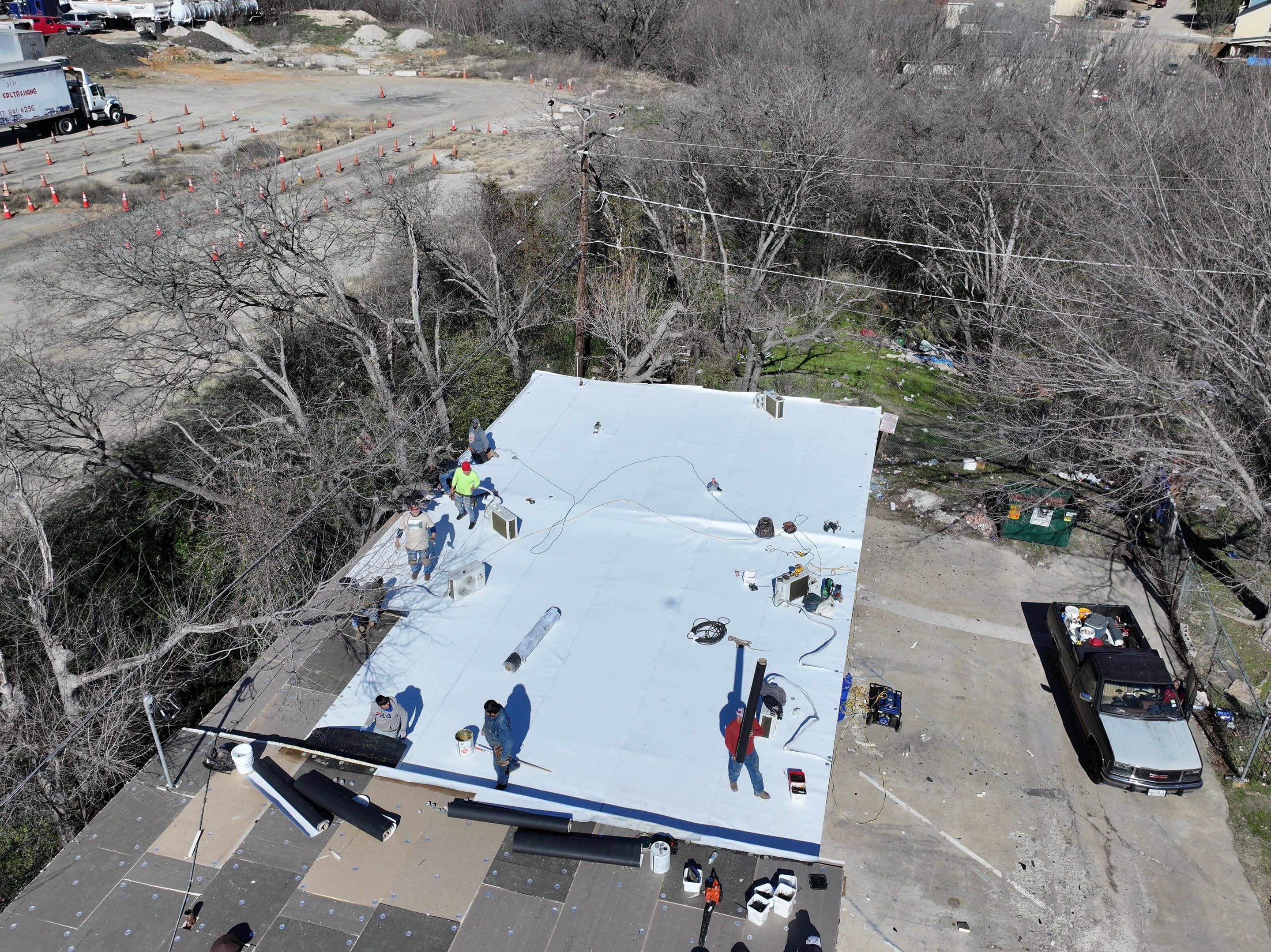 Commercial roofing overlay using GAF TPO over an old ballast roof by Becker Roofing and Exteriors