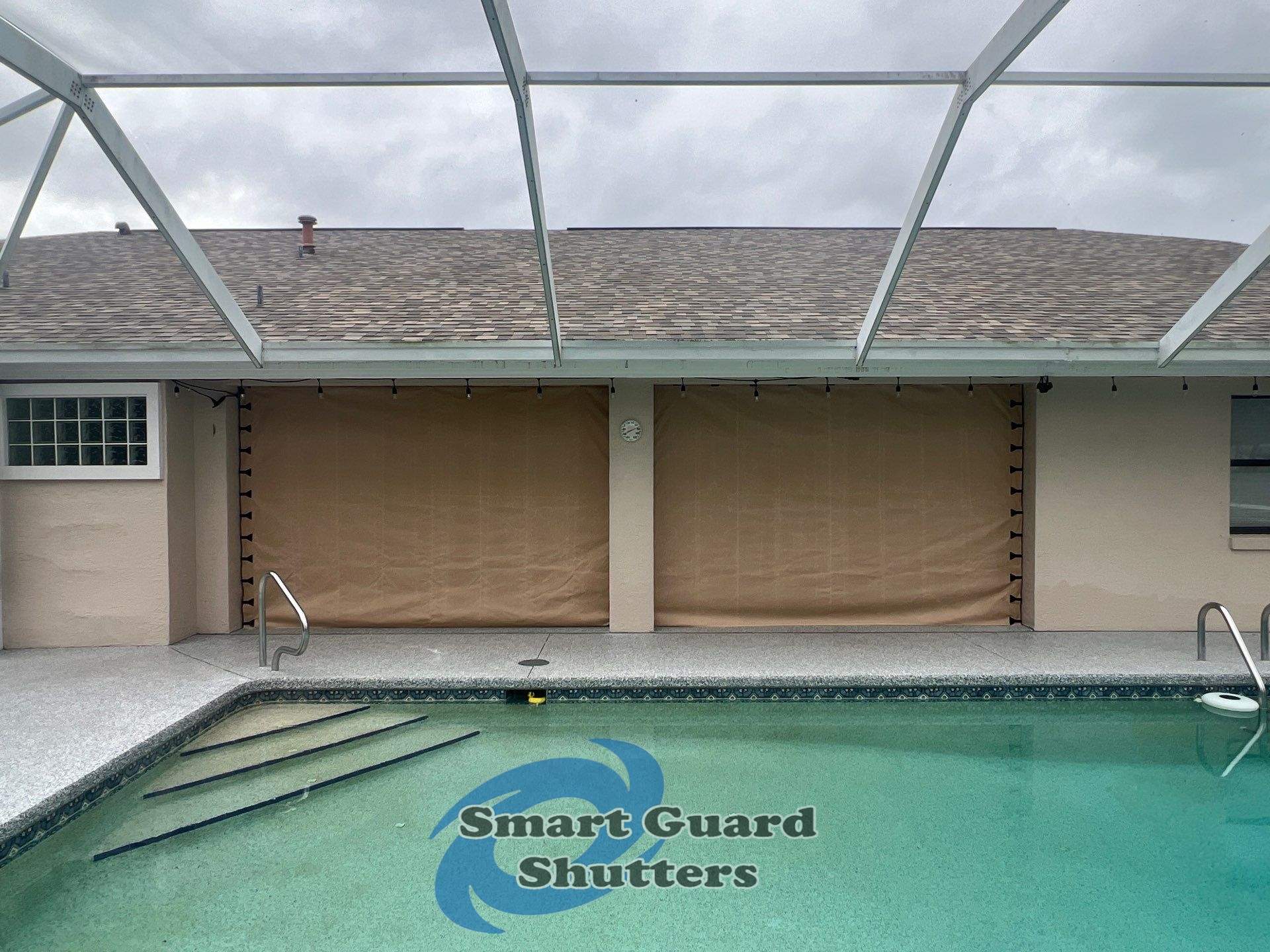 AstroGuard Hurricane Fabric in Tan by Smart Guard Shutters