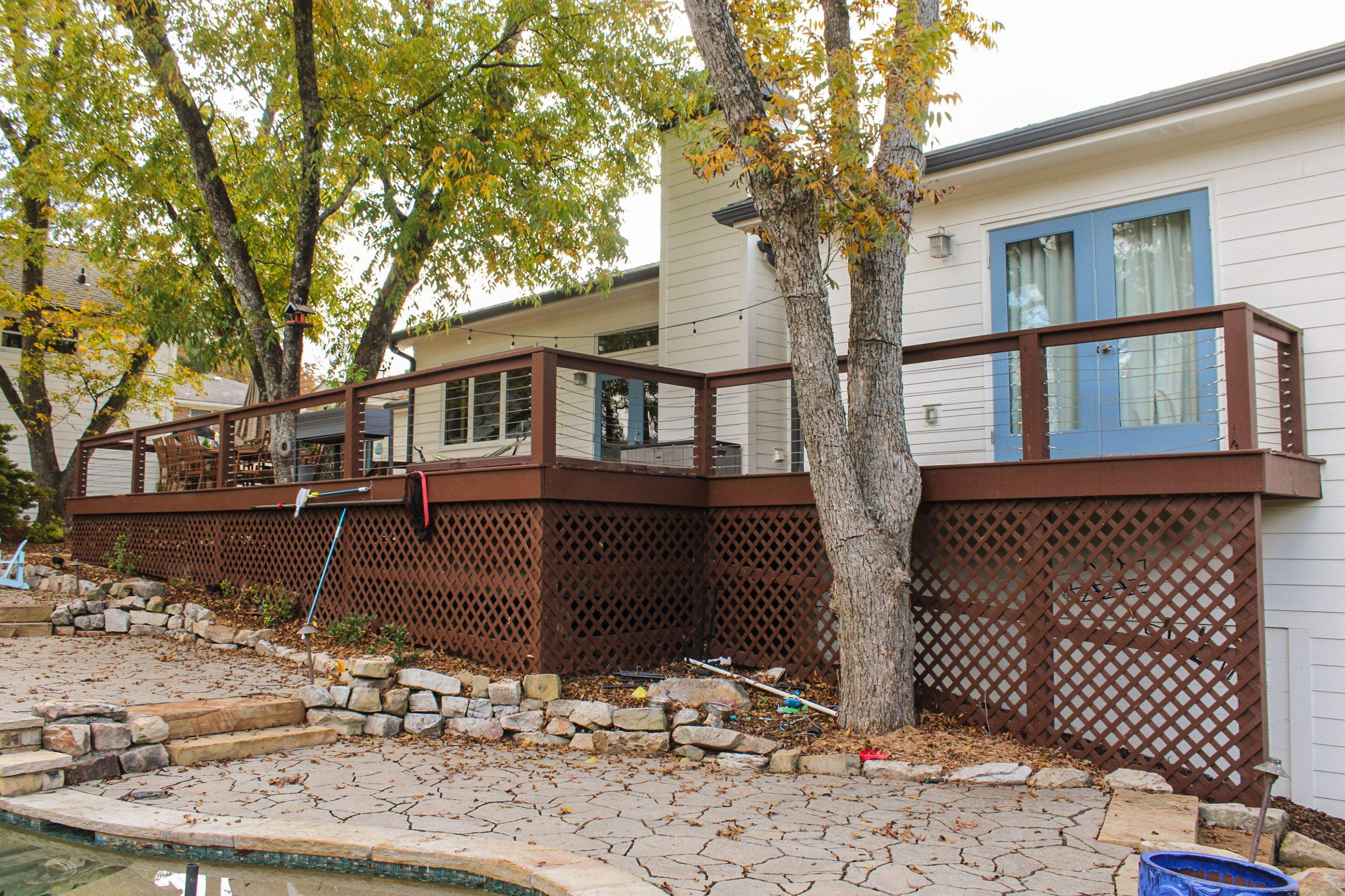 Deck Resurface with Glass Paneling and Deckorators Voyage Series Products by Nelson Exteriors 
