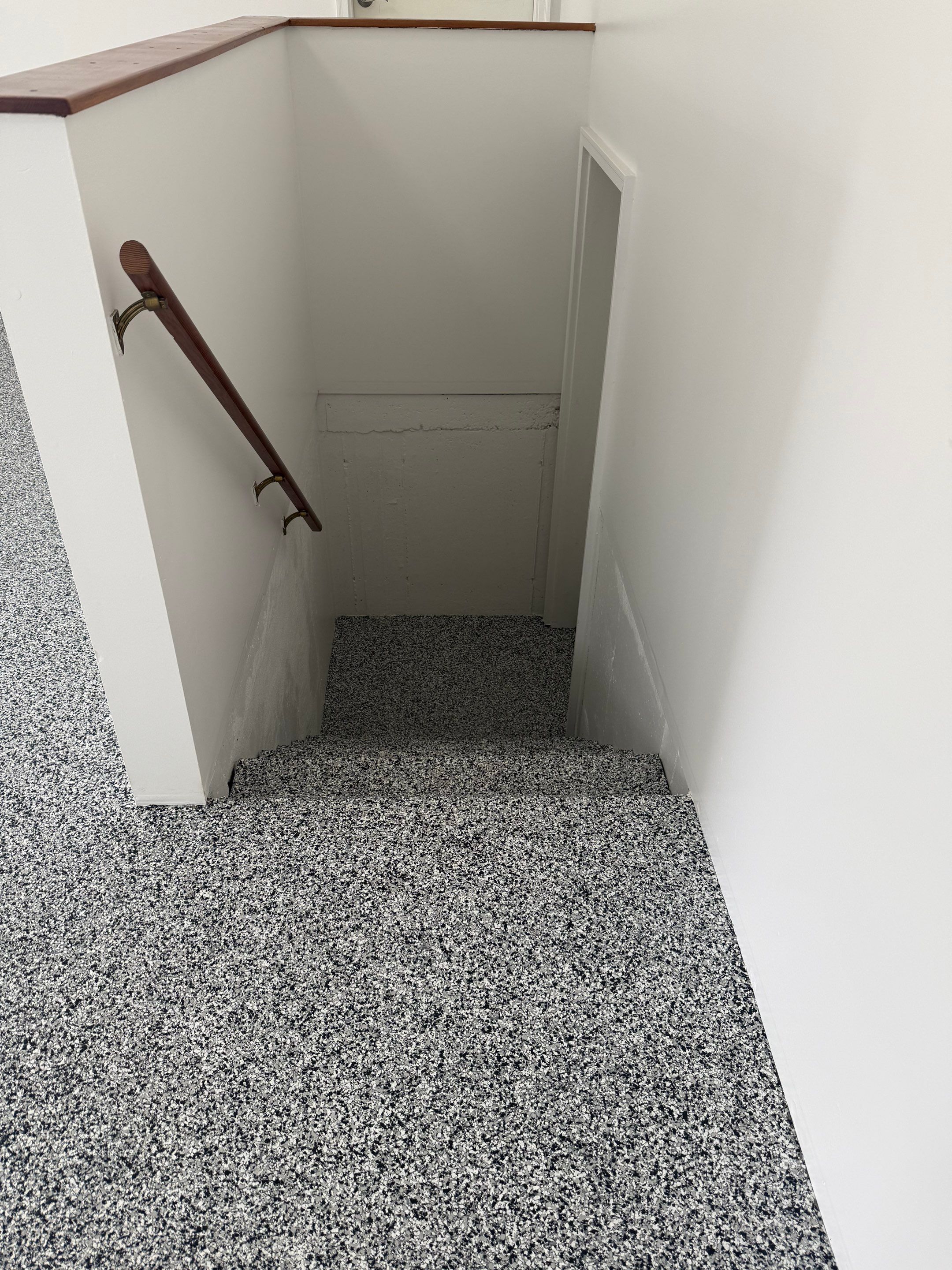 Full Garage Floor and Basement Stair Epoxy Coating in Sioux Falls by Select Painting, Coatings & Garage Cabinets