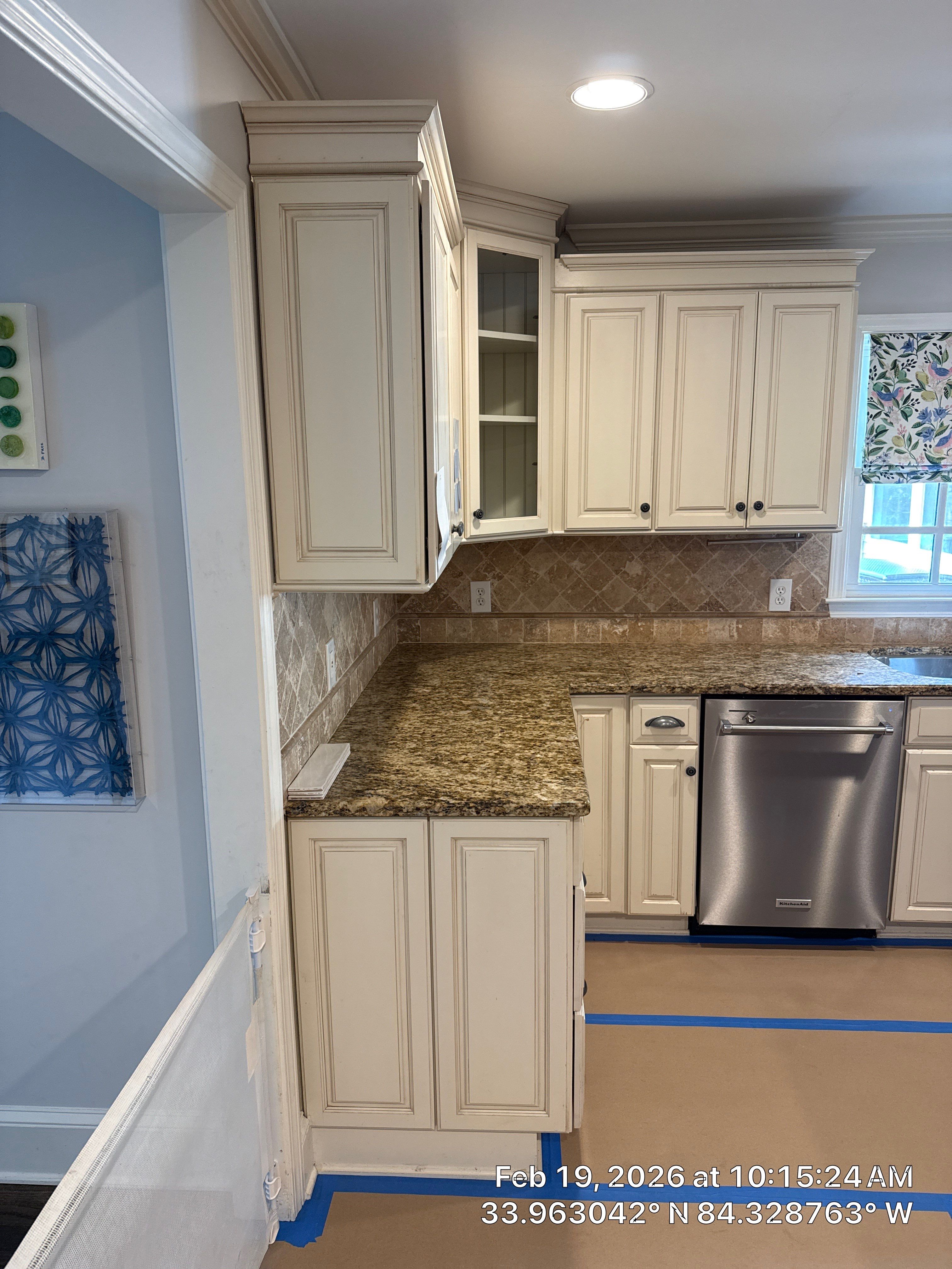 Kitchen Remodel in Dunwoody Featuring White Cabinetry and Blue Island by Heart & Home Kitchen & Bath Remodeling LLC