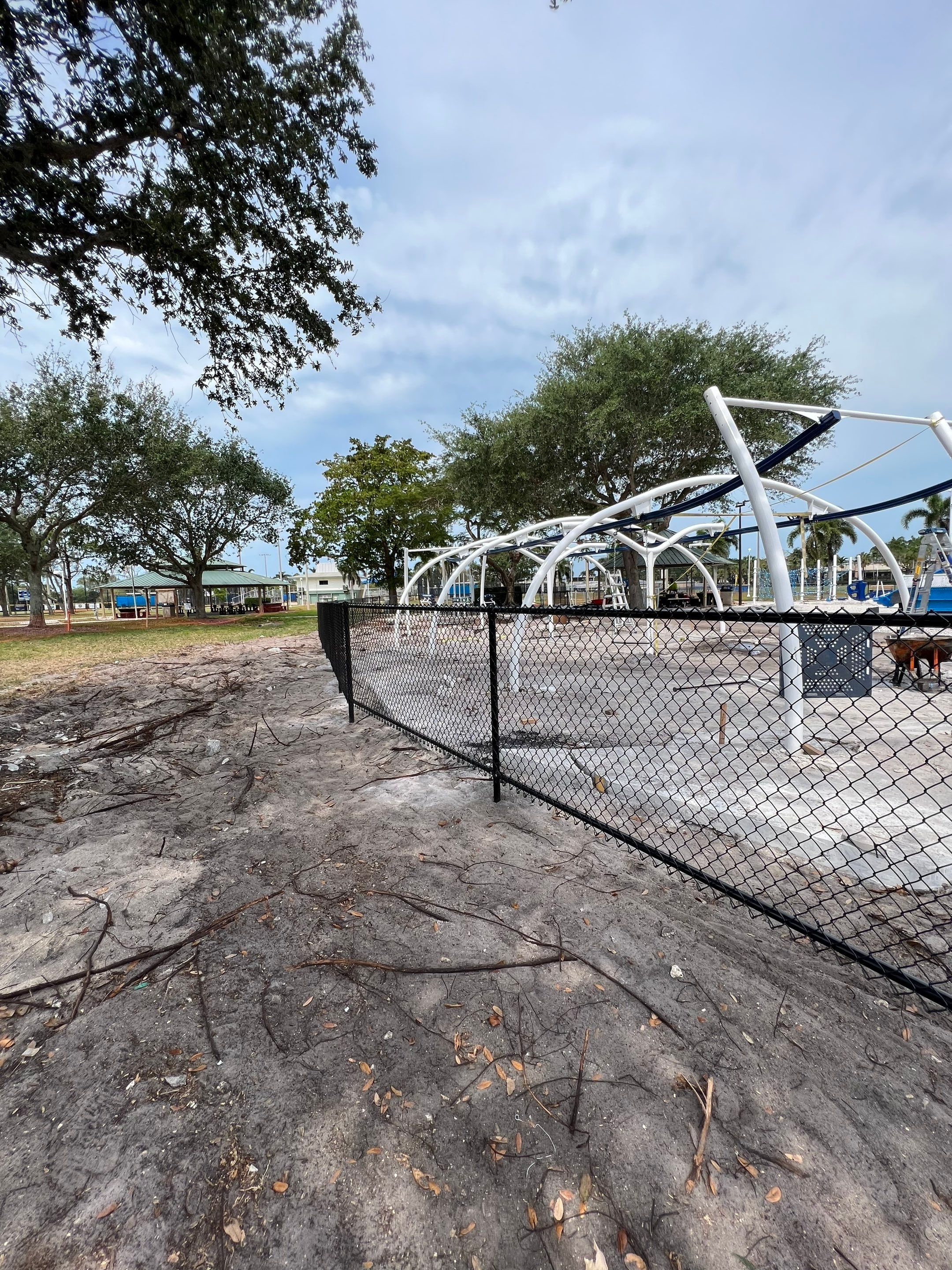 Vinyl Coated Chain-link fence for the City of Naples around Fleischmann Park Playground.  by Asap fence and gates, LLC