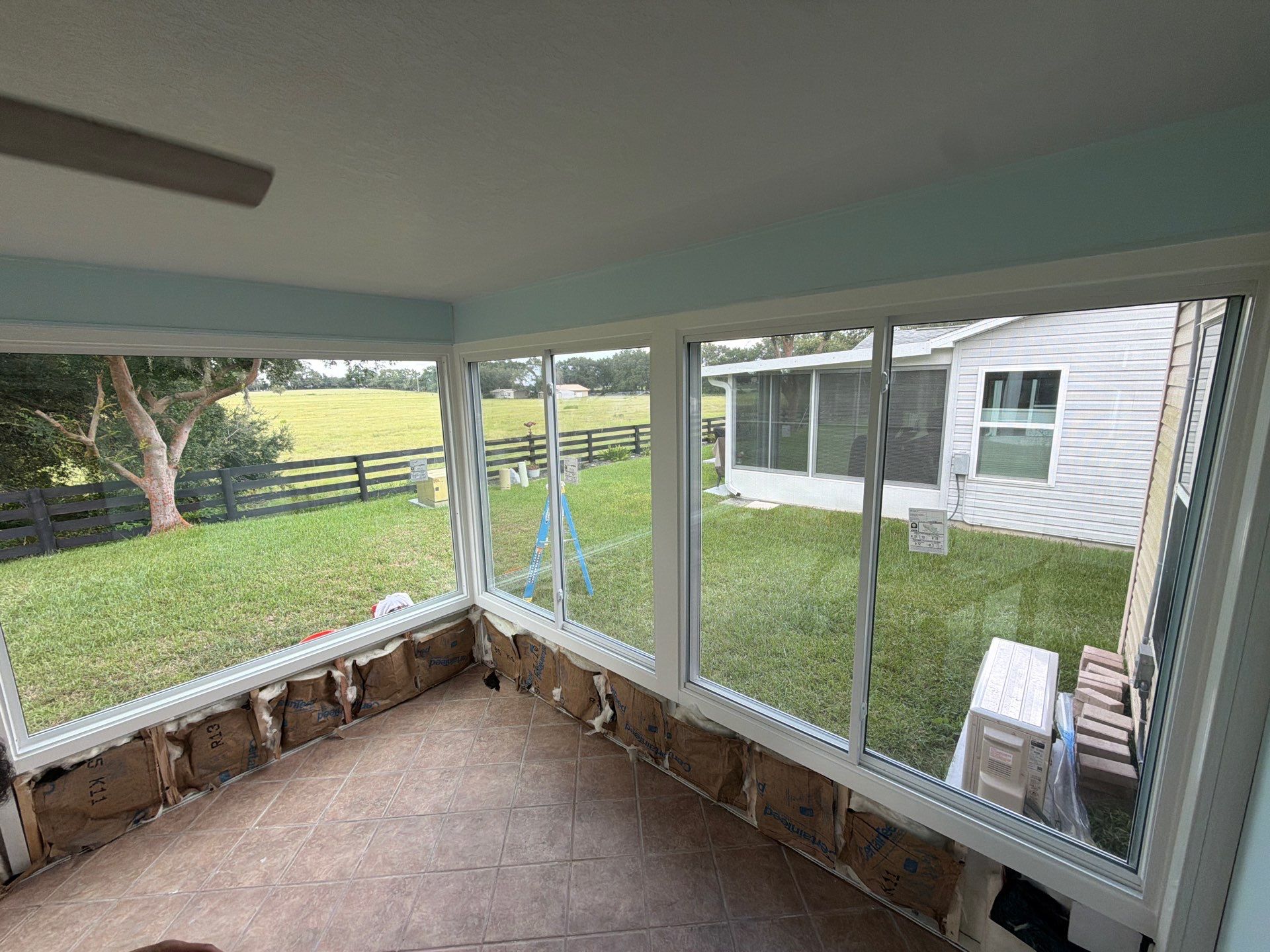 Sunroom Conversion with Alside Windows and Provia Door in The Villages by Windows & Doors Store