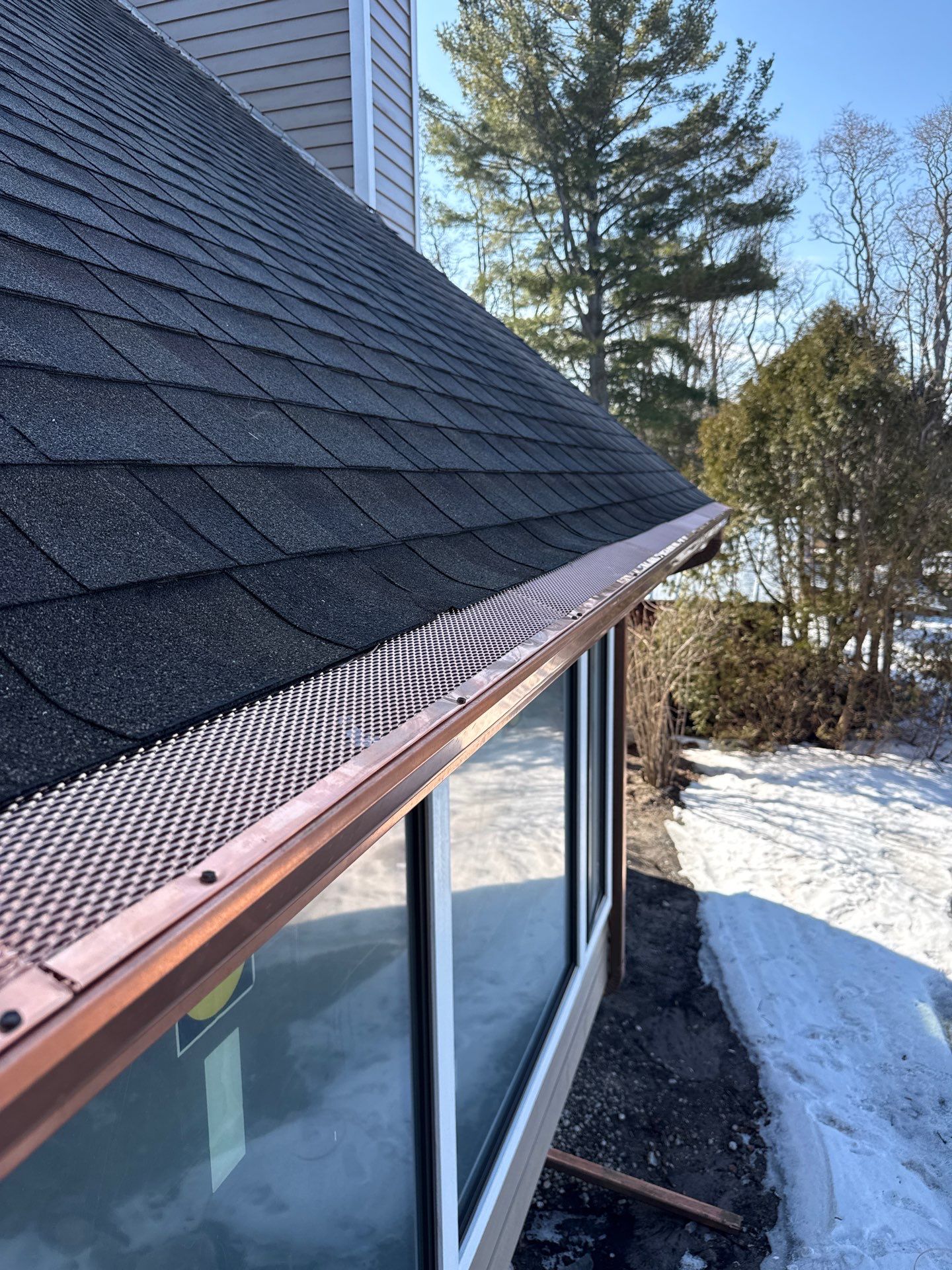 Copper Half Round Gutter Installation in Leland, MI by Rainbow Seamless Systems