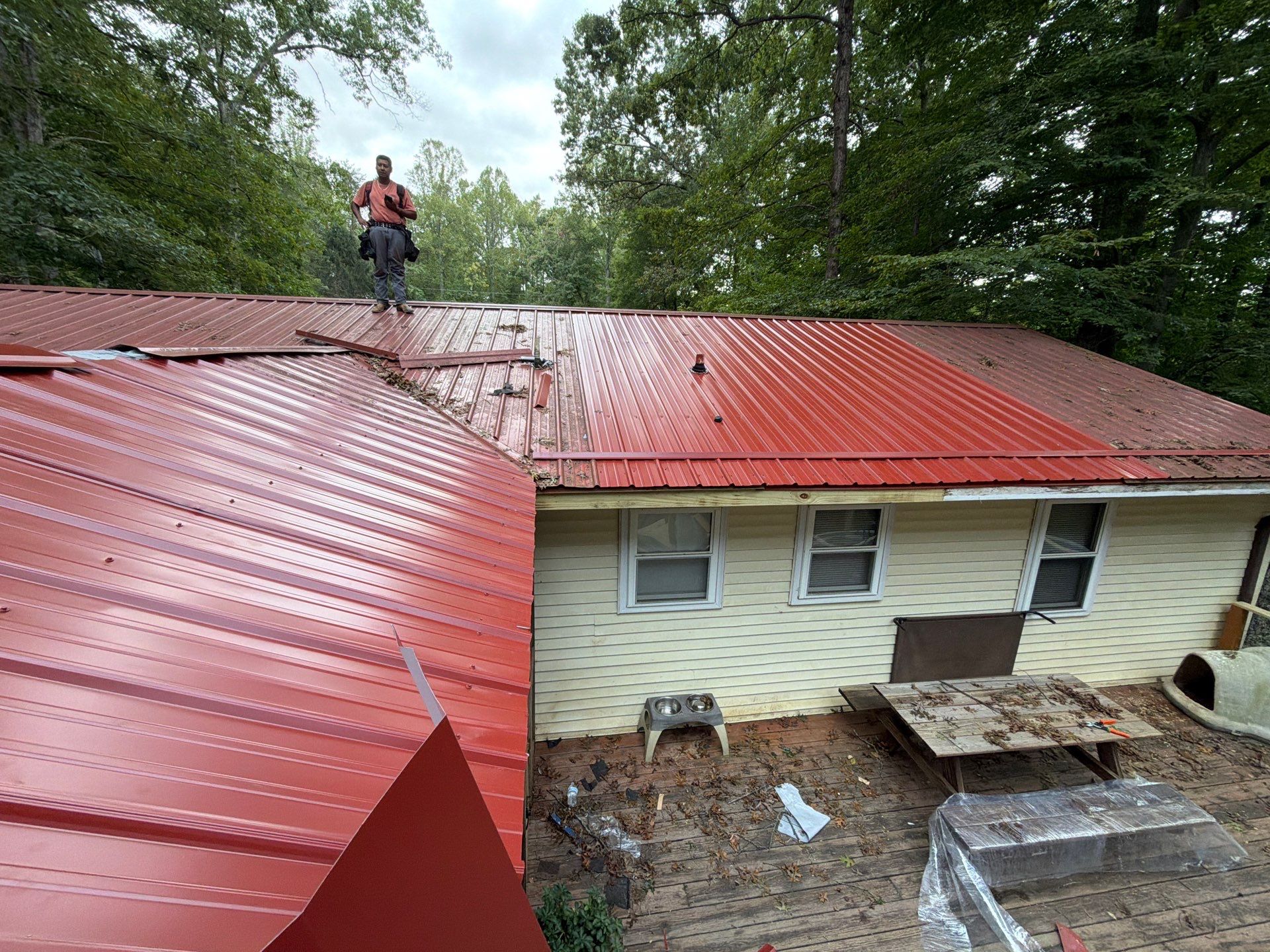 Red Metal Roof Restoration and Wood Fascia Replacement in Barboursville by Cade Construction