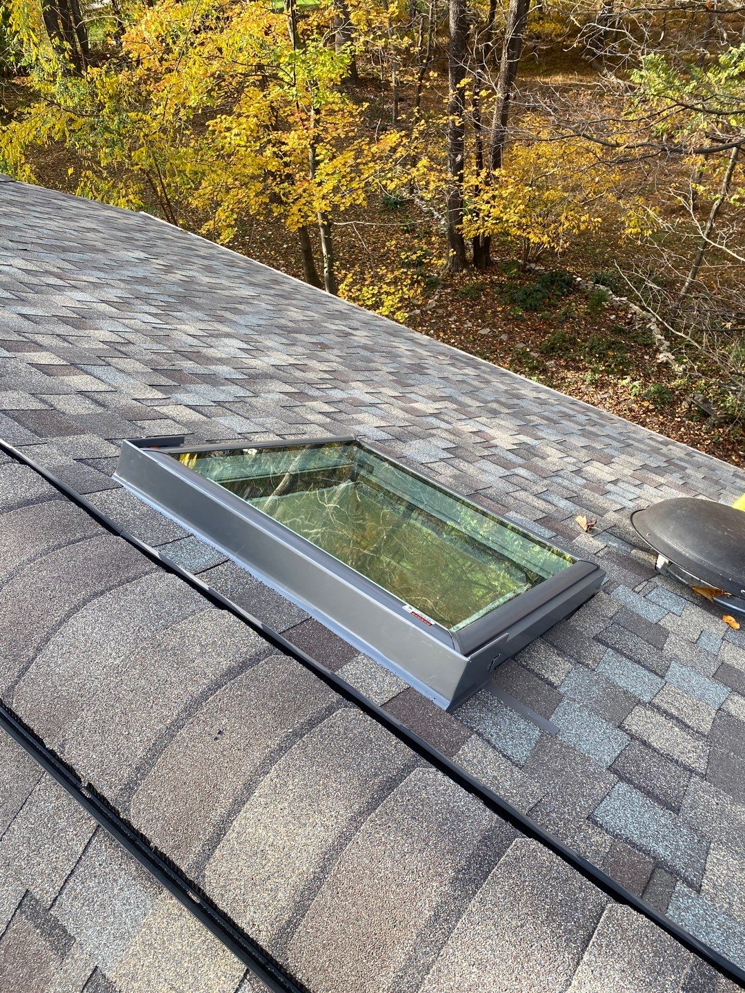 Install new shingles and new skylights  by Alpha Design Services