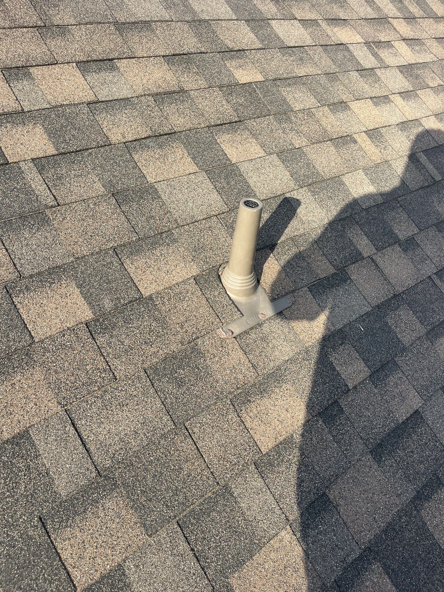 Tan exterior with IKO Driftshake by Tejas Roofworks + Restoration