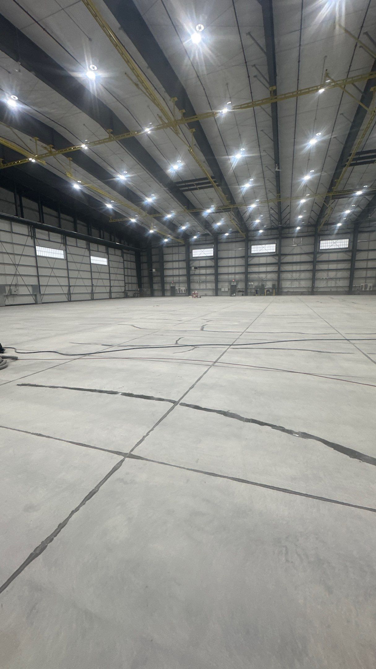 Airplane Hanger using Light Grey Commercial Penntek Epoxy by Croc Coatings, LLC