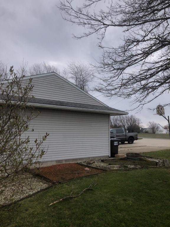Storm damage roof replacement by Nitro Roofing and Construction