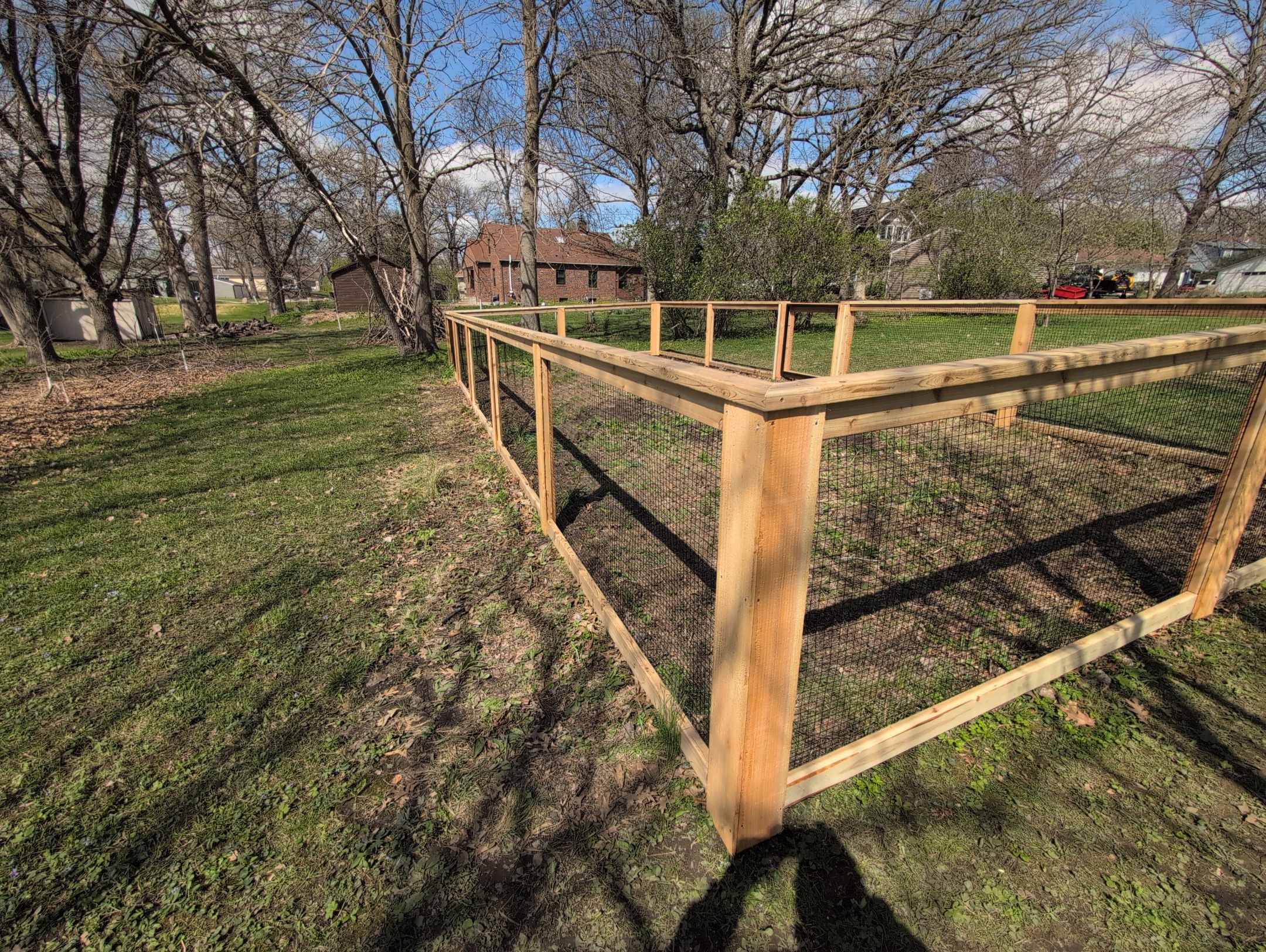 Custom Cedar Wood Garden Fence Installation in Cedar Falls by Perfect Picket Fence and Stain