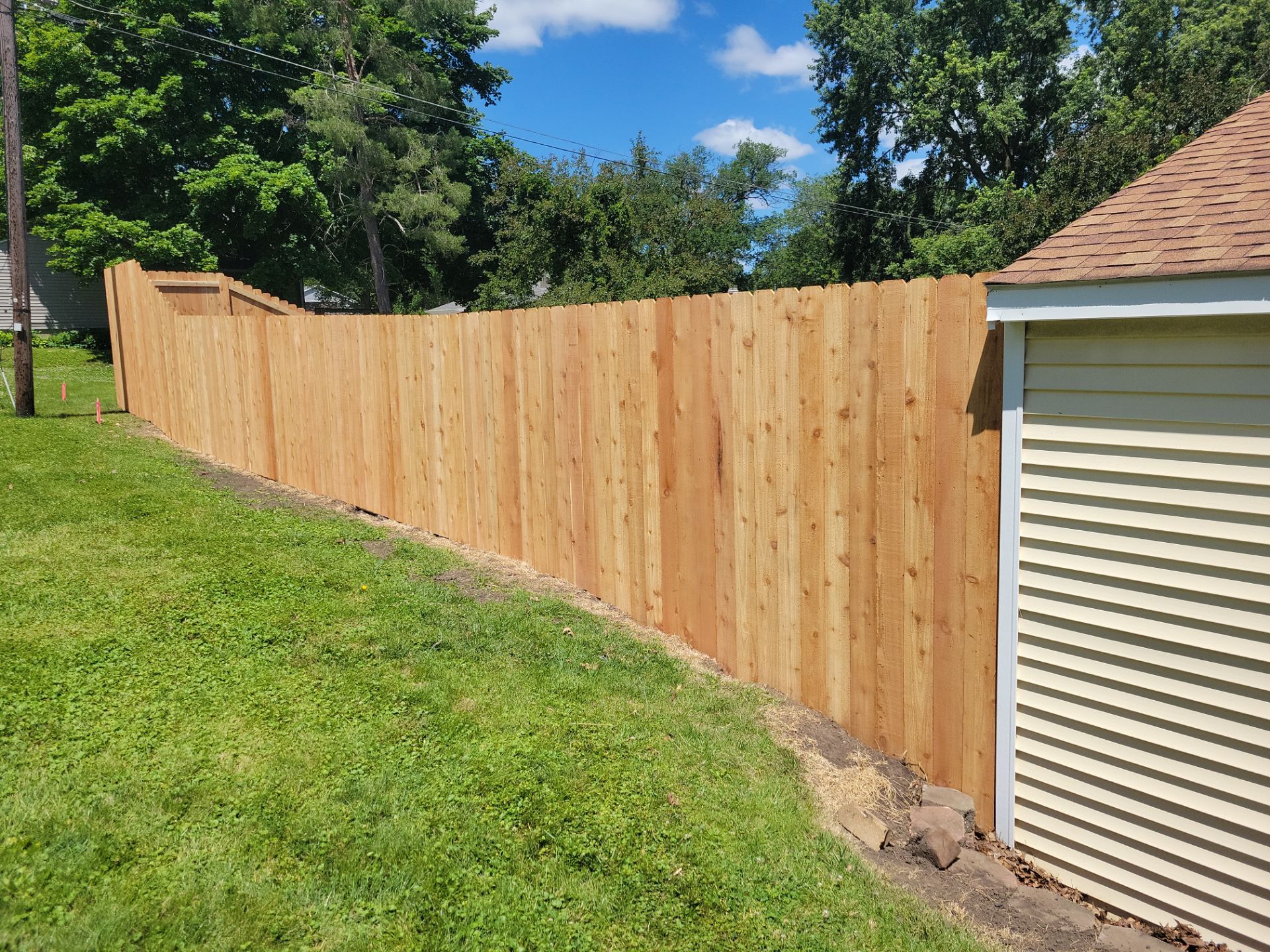 Custom Cedar Unstained Wood Privacy Fence Installation in Cedar Falls by Perfect Picket Fence and Stain
