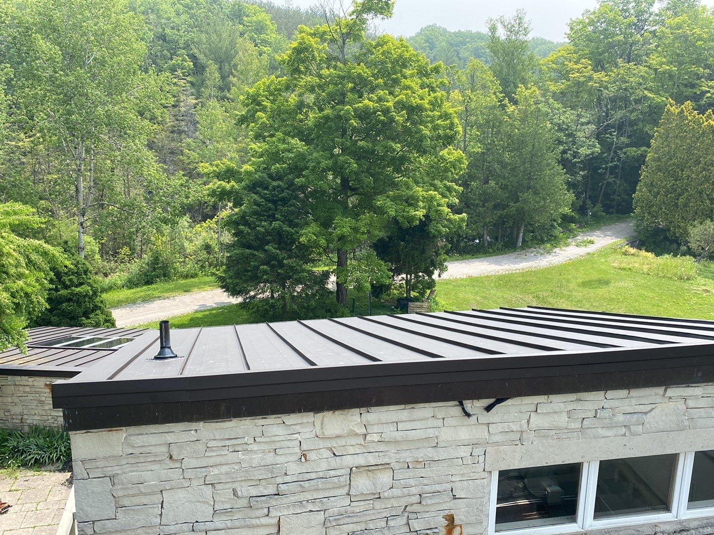 Roof Replacement using 16" Standing Seam Panels by Jay Carter Roofing & Sheet Metal