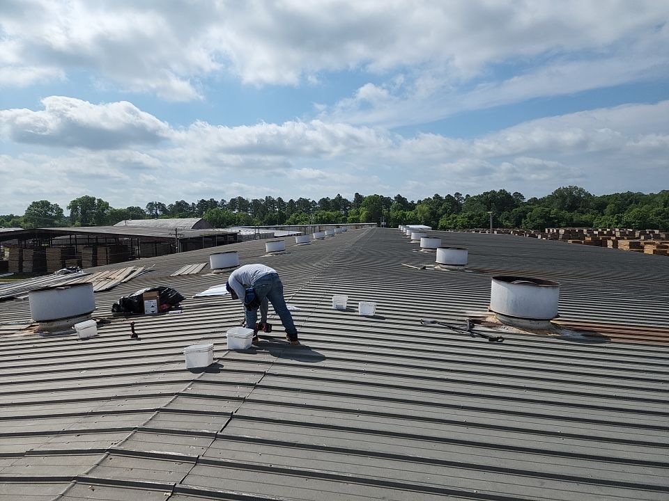 Commercial Roofing Installation using Aluminum Roofing panels by Hostetler Roofing
