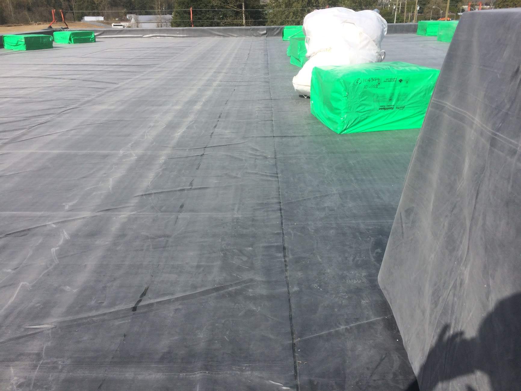 Commercial Roofing Installation using EPDM loose lay with balast by Top Notch Roofing Inc