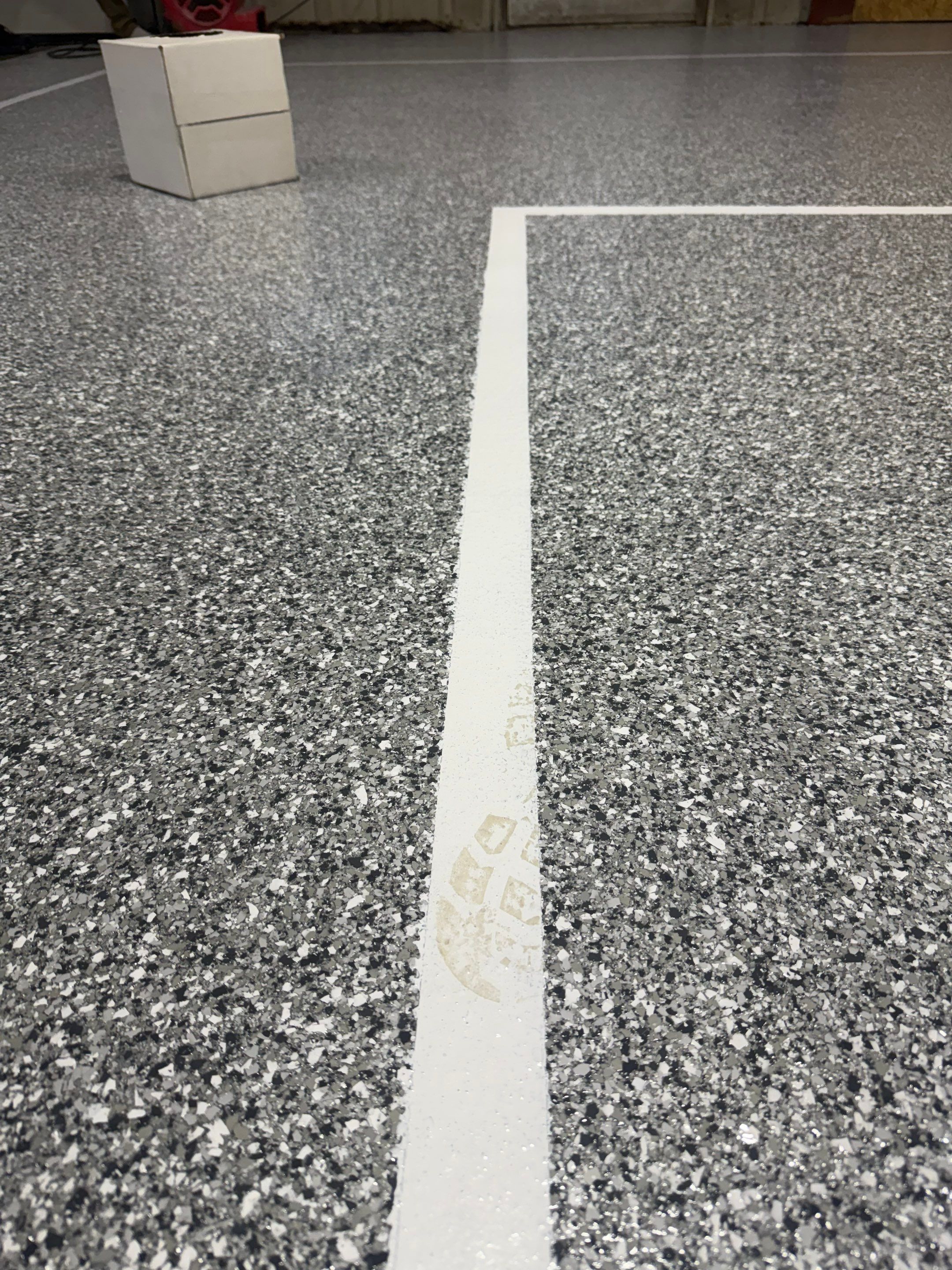 Custom Polyurea Shop Floor with Basketball Court Lines in Rock Valley by Select Painting, Coatings & Garage Cabinets
