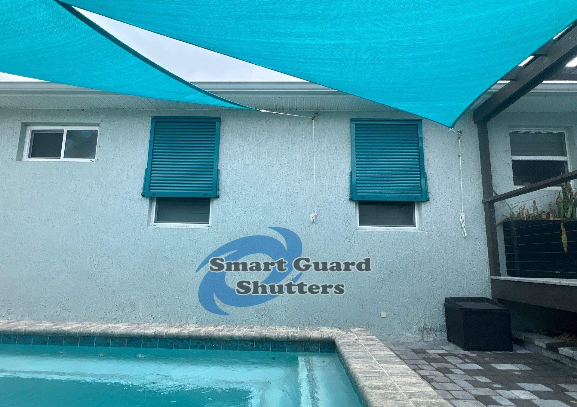Impact Bahama Shutters in Water Blue by Smart Guard Shutters