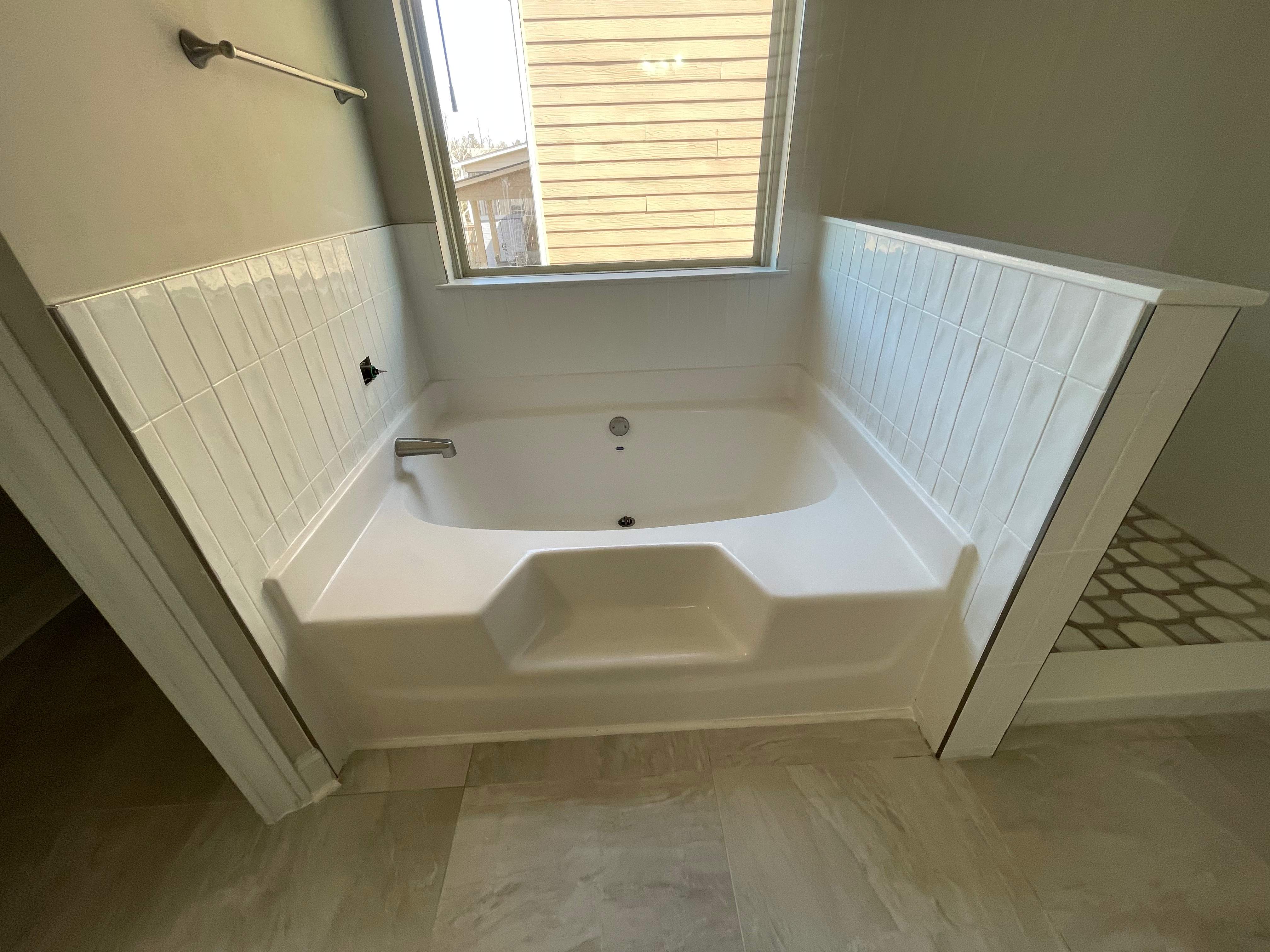 Shower retile and bathroom flooring by Prudencio